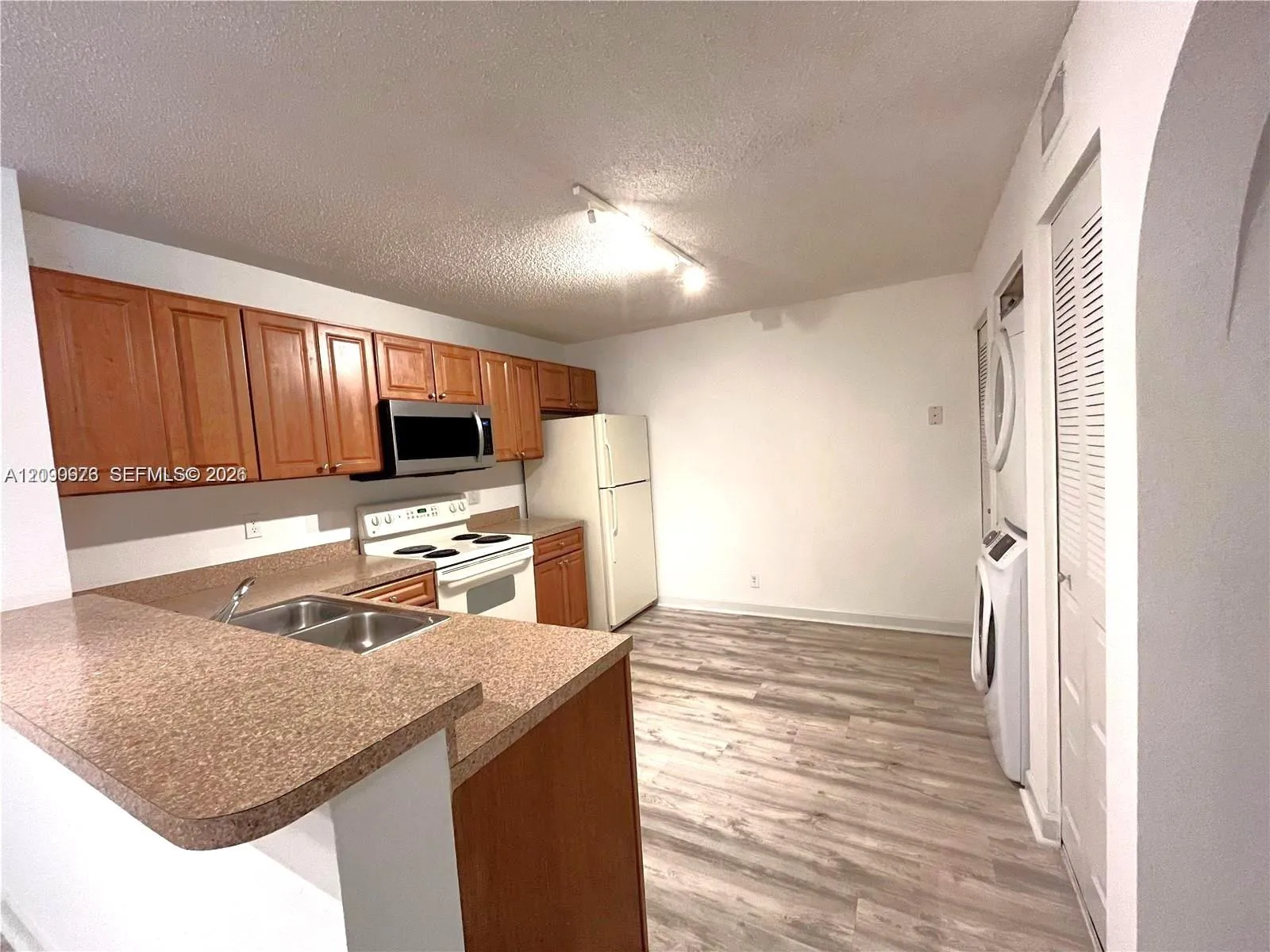 Foto de propiedad en 10161 W Sunrise Boulevard 203, Plantation, FL 33322 Plantation con MLS# 