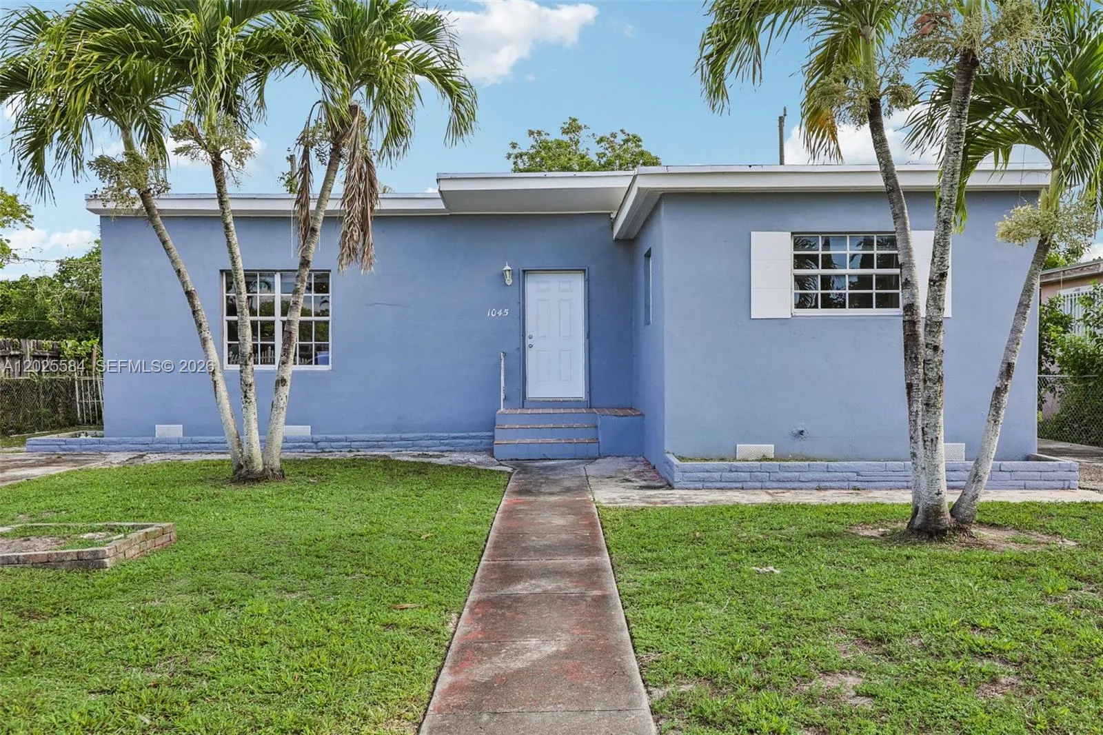 Foto de propiedad en 1045 NW 115th Street, Miami, FL 33168 Miami con MLS# 