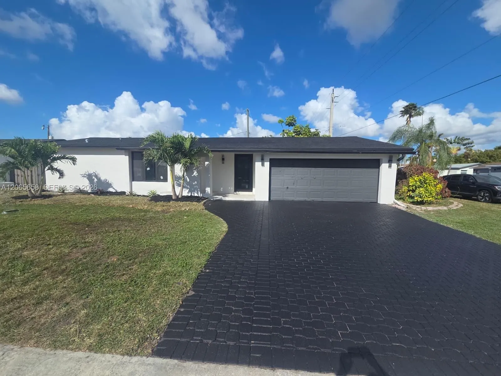 Foto de propiedad en 10581 NW 28th Manor, Sunrise, FL 33322 Sunrise con MLS# 