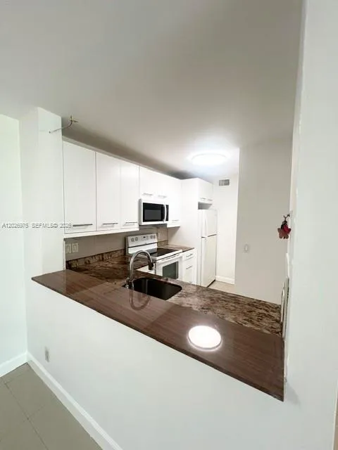 Foto de propiedad en 10733 Cleary Boulevard 112, Plantation, FL 33324 Plantation con MLS# 