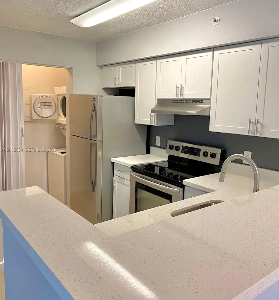 Foto de propiedad en 12118 Saint Andrews Place 107, Miramar, FL 33025 Miramar con MLS# 