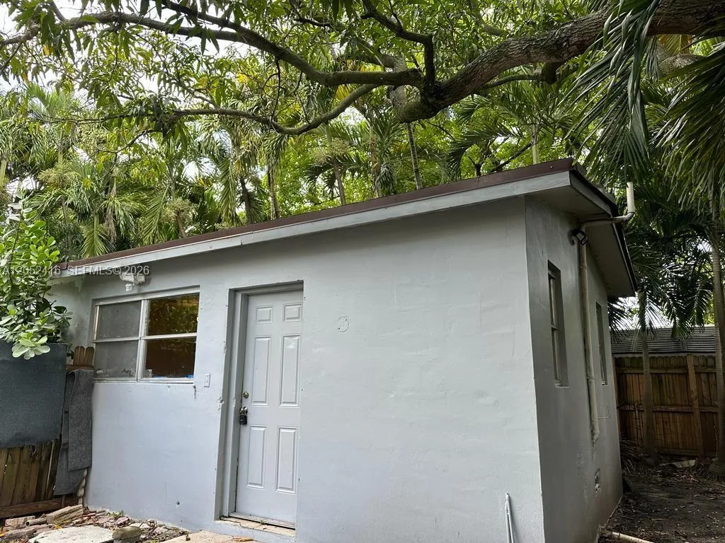 Mango tree above. About 700 SF outside yard. Outlet outside. Lights at night.