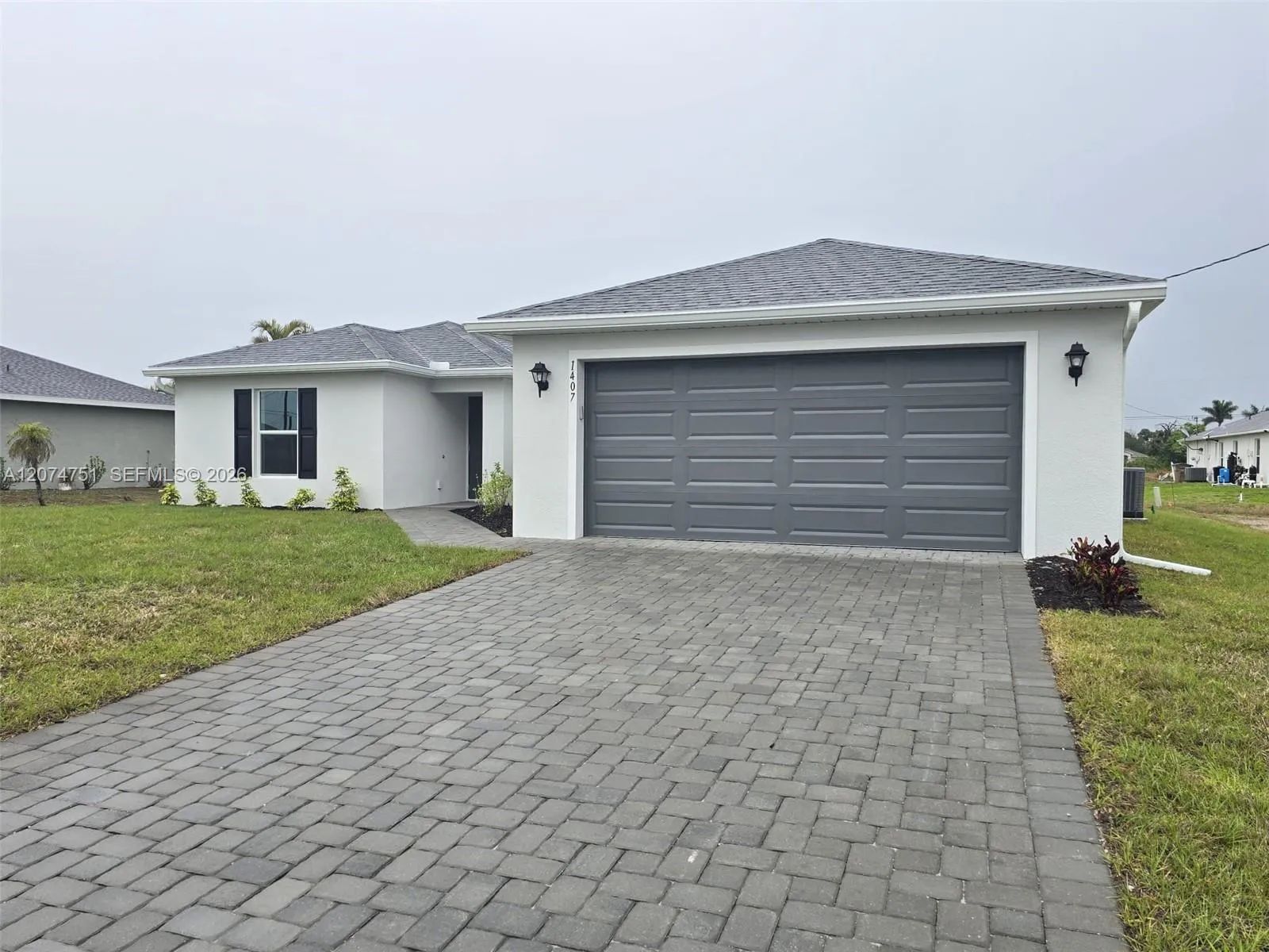Foto de propiedad en 1407 NW 17th Place, Cape Coral, FL 33993 Cape Coral con MLS# 