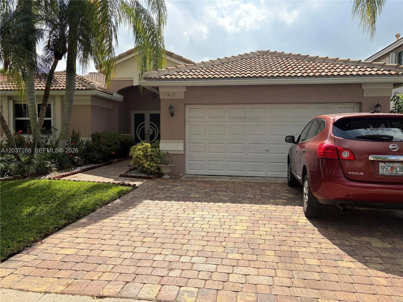 Foto de propiedad en 1412 NW 129th Terrace, Sunrise, FL 33323 Sunrise con MLS# 