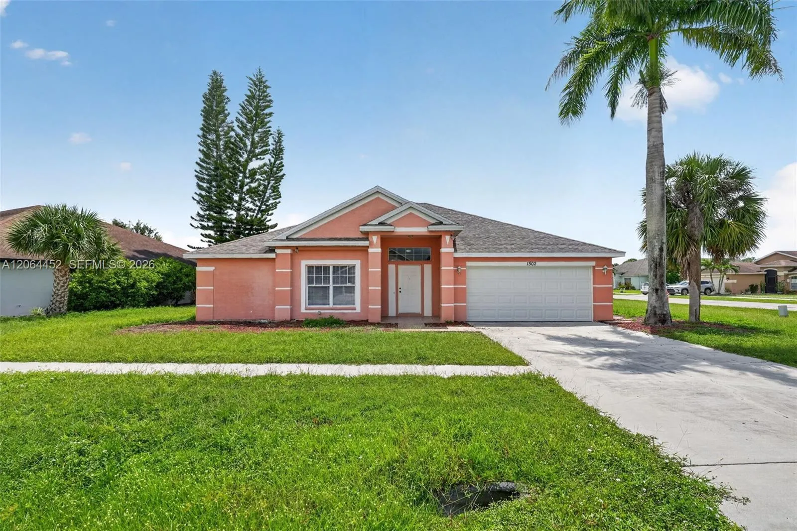 Foto de propiedad en 1502 Scholar Court, Lehigh Acres, FL 33971 Lehigh Acres con MLS# 