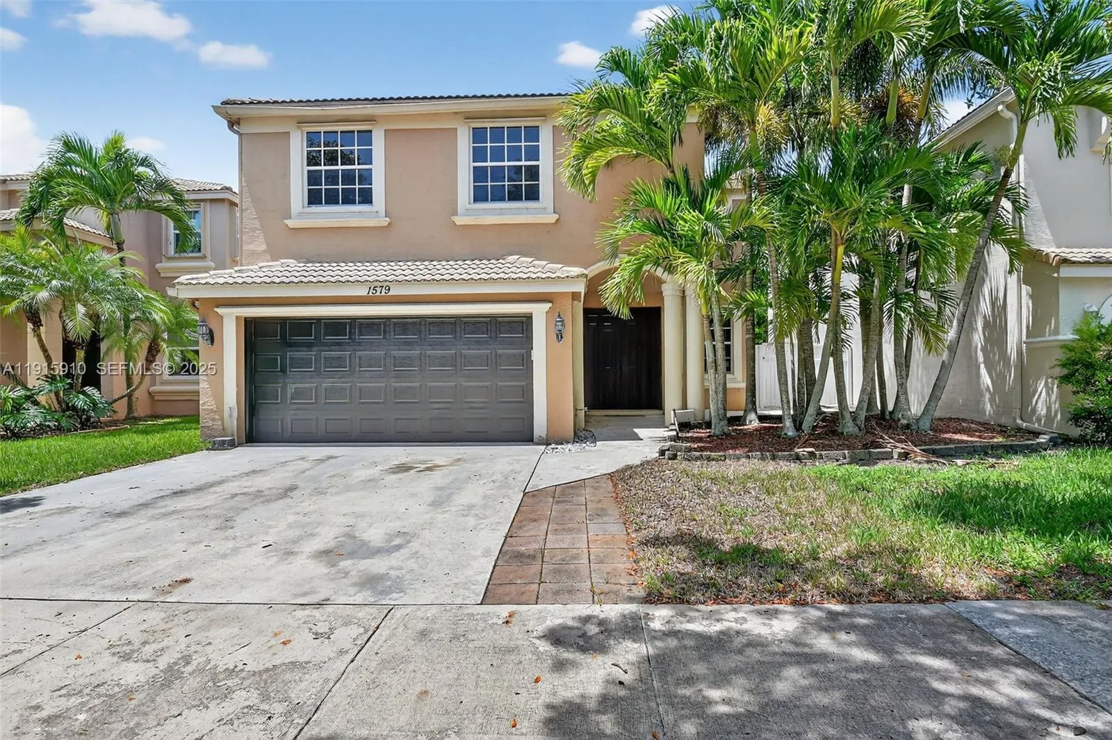 Foto de propiedad en 1579 Briar Oak Drive, Royal Palm Beach, FL 33411 Royal Palm Beach con MLS# 