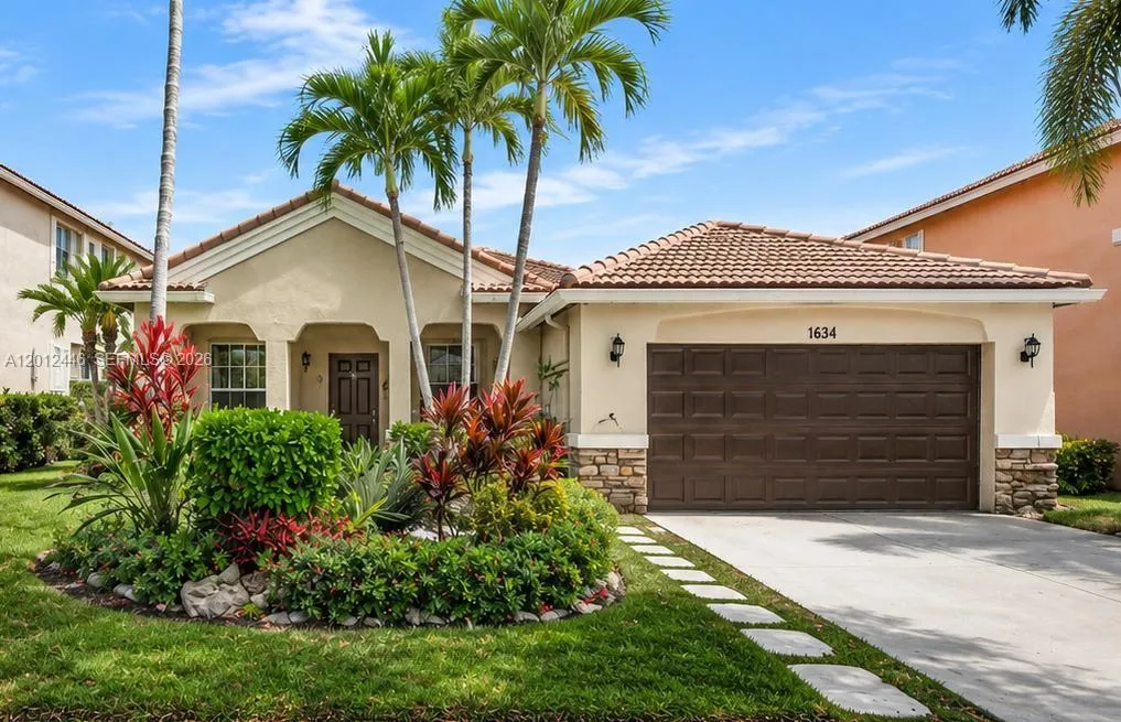 Foto de propiedad en 1634 Sandpiper Circle, Weston, FL 33327 Weston con MLS# 