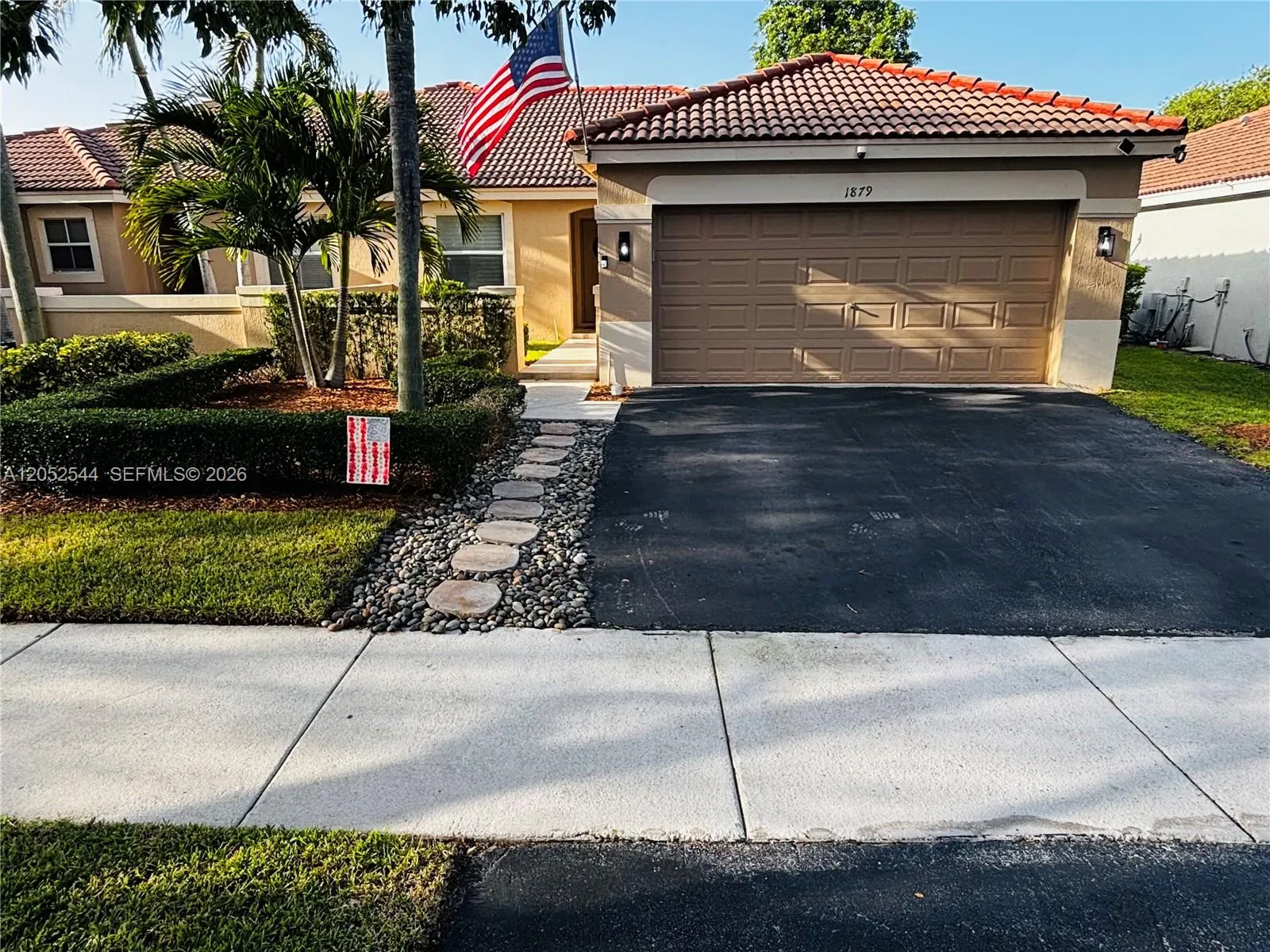 Foto de propiedad en 1879 Andromeda Lane, Weston, FL 33327 Weston con MLS# 