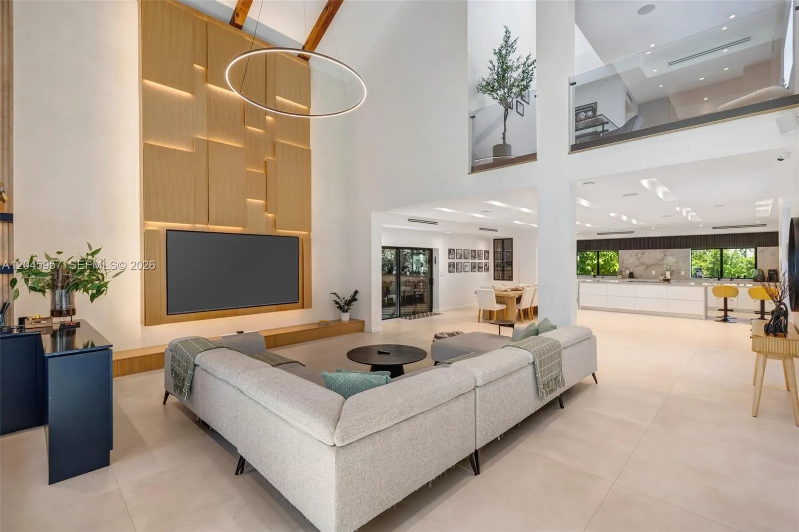 Every detail reflects thoughtful craftsmanship, from the custom millwork and integrated media wall to the dramatic ceiling heights that define the home’s architectural character.