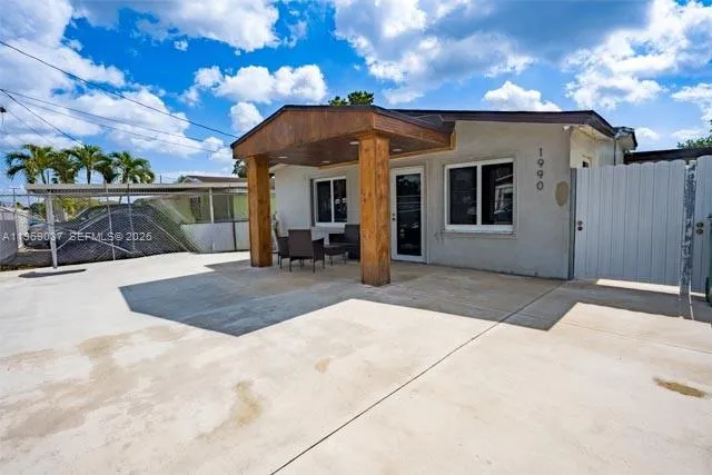Foto de propiedad en 1990 NW 154th Street, Miami Gardens, FL 33054 Miami Gardens con MLS# 