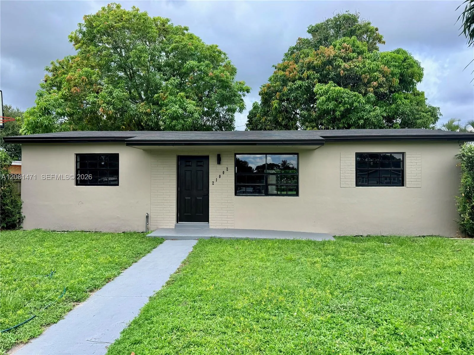 Foto de propiedad en 21002 NW 34th Court, Miami Gardens, FL 33056 Miami Gardens con MLS# 