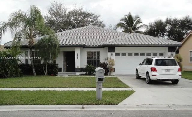 Foto de propiedad en 2444 Stonegate Drive, Wellington, FL 33414 Wellington con MLS# 