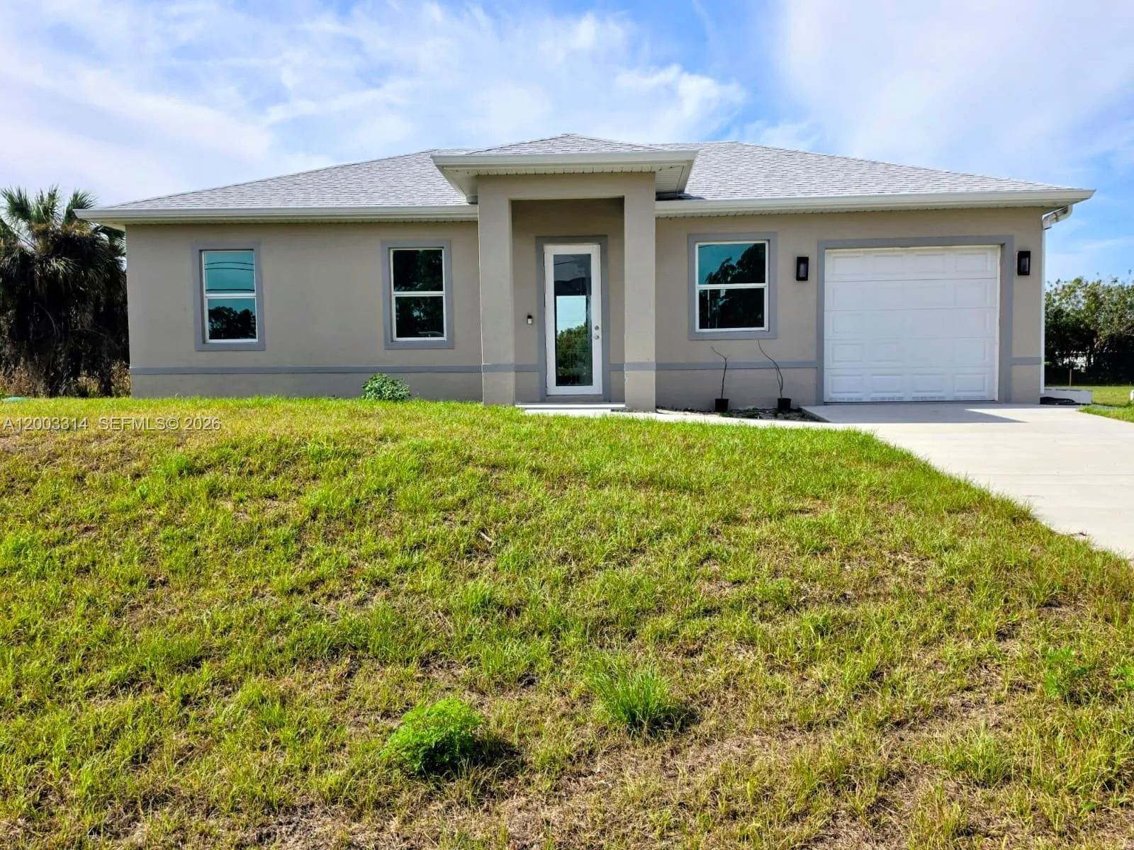 Foto de propiedad en 402 Harrison Drive, Lehigh Acres, FL 33936 Lehigh Acres con MLS# 