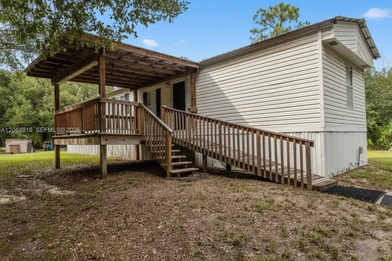 Foto de propiedad en 450 Wildwood Avenue, Clewiston, FL 33440 Clewiston con MLS# 