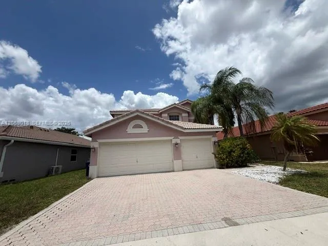 Foto de propiedad en 5402 NW 120th Avenue, Coral Springs, FL 33076 Coral Springs con MLS# 