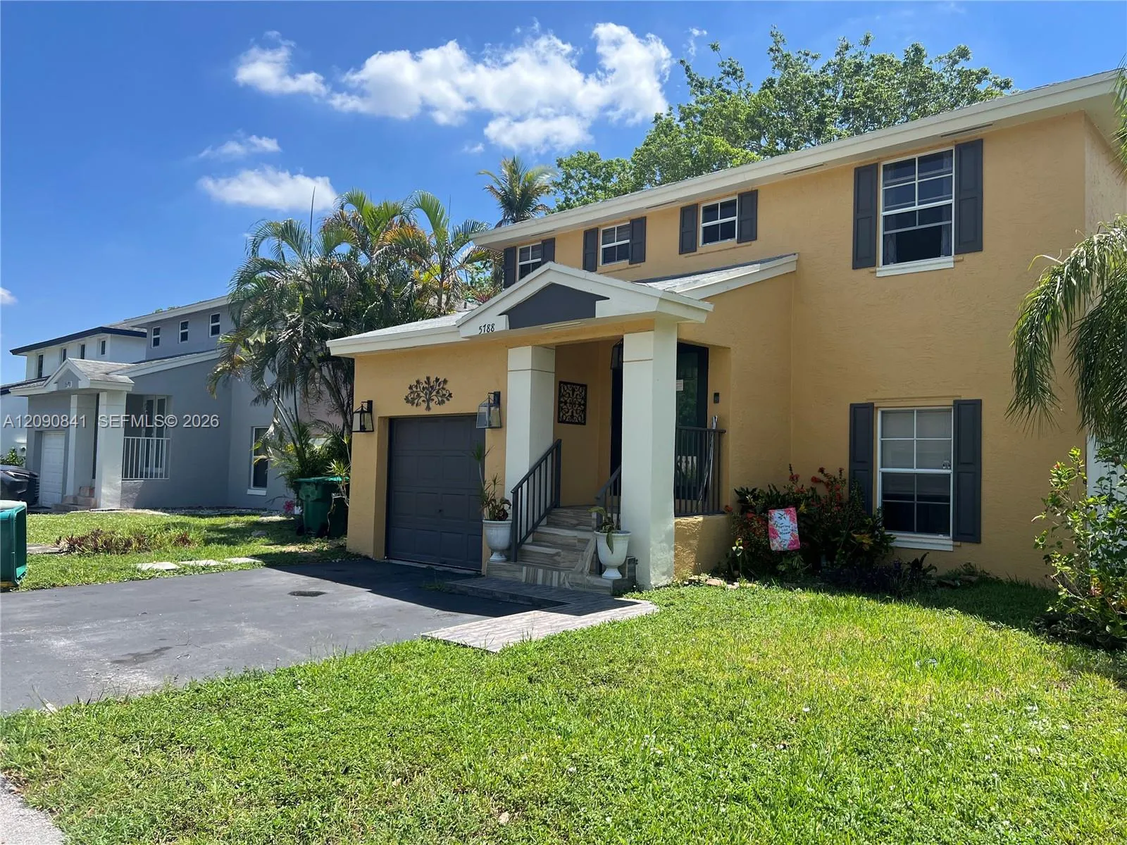 Foto de propiedad en 5788 Woodland Point Drive, Tamarac, FL 33319 Tamarac con MLS# 