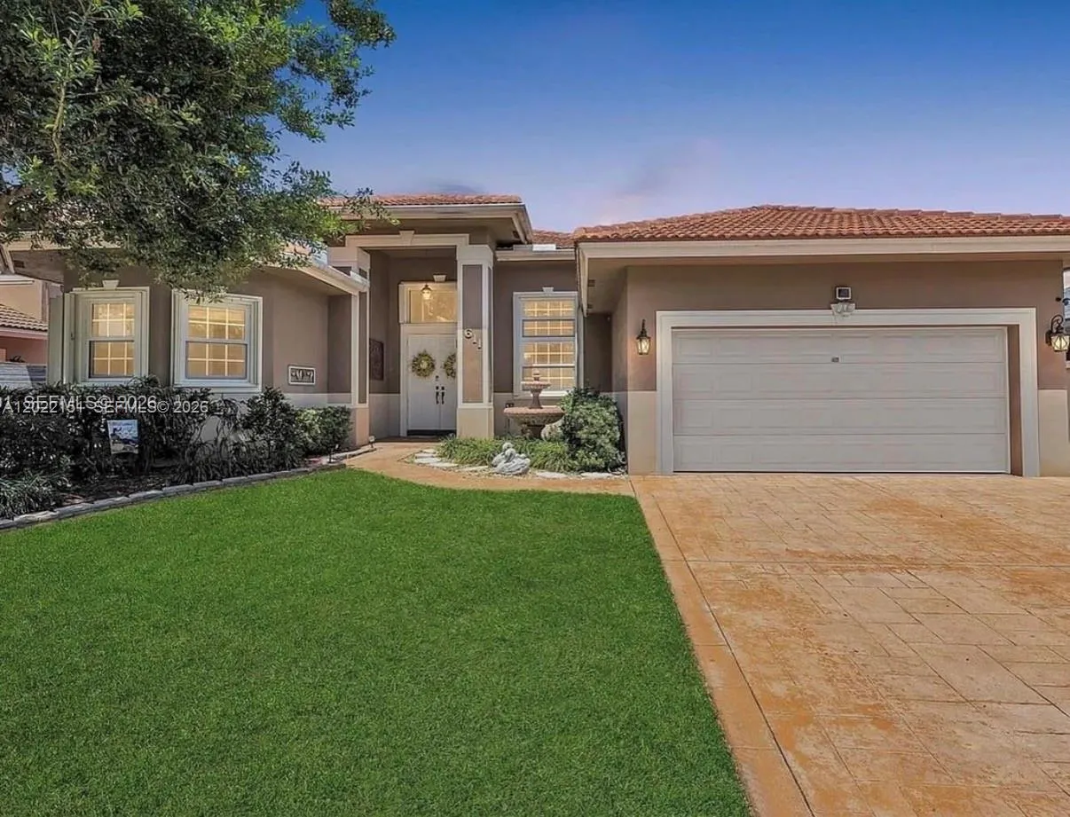 Foto de propiedad en 611 NW 42nd Avenue, Coconut Creek, FL 33066 Coconut Creek con MLS# 