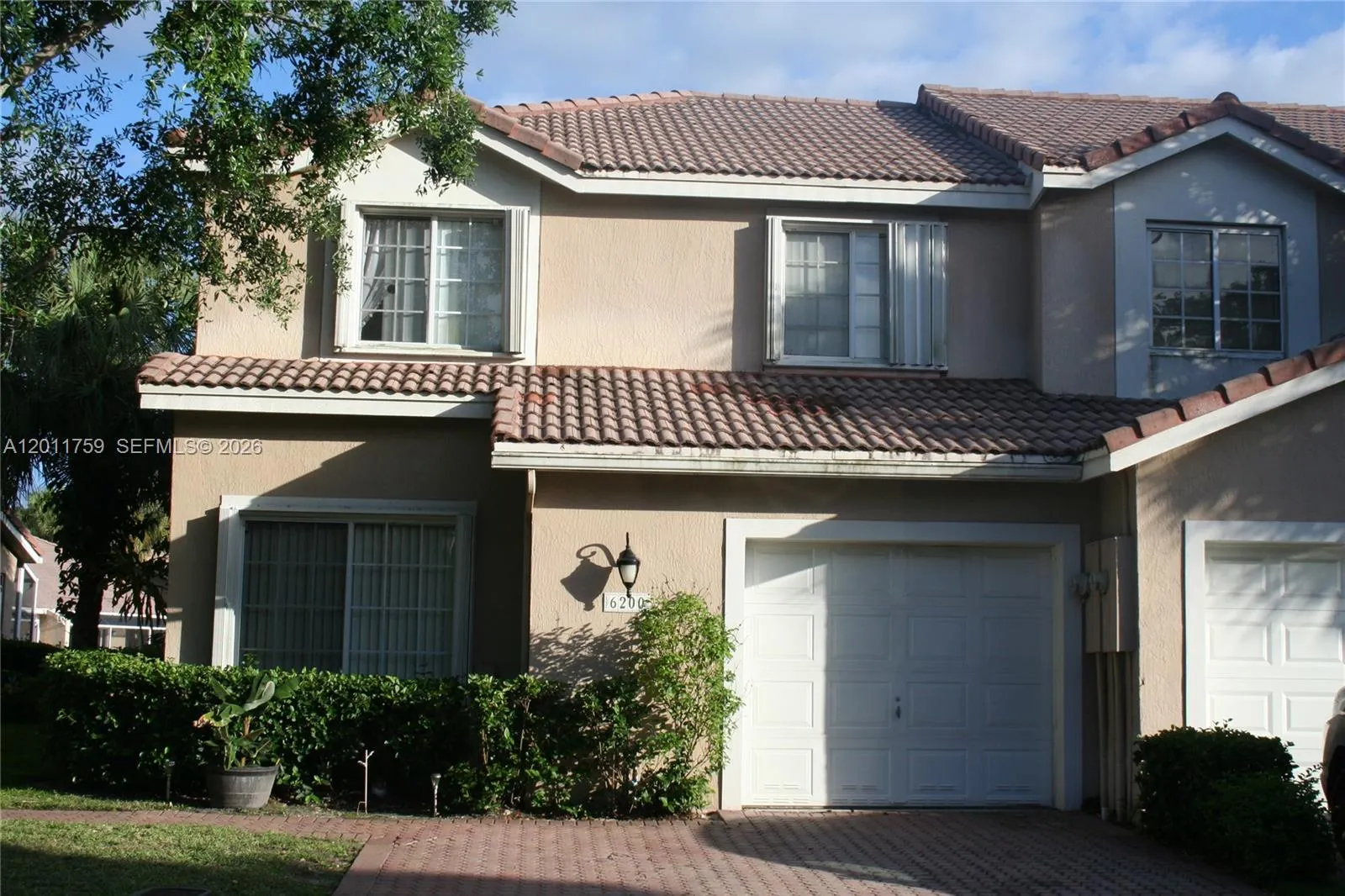 Foto de propiedad en 6200 NW 74th Court, Parkland, FL 33067 Parkland con MLS# 