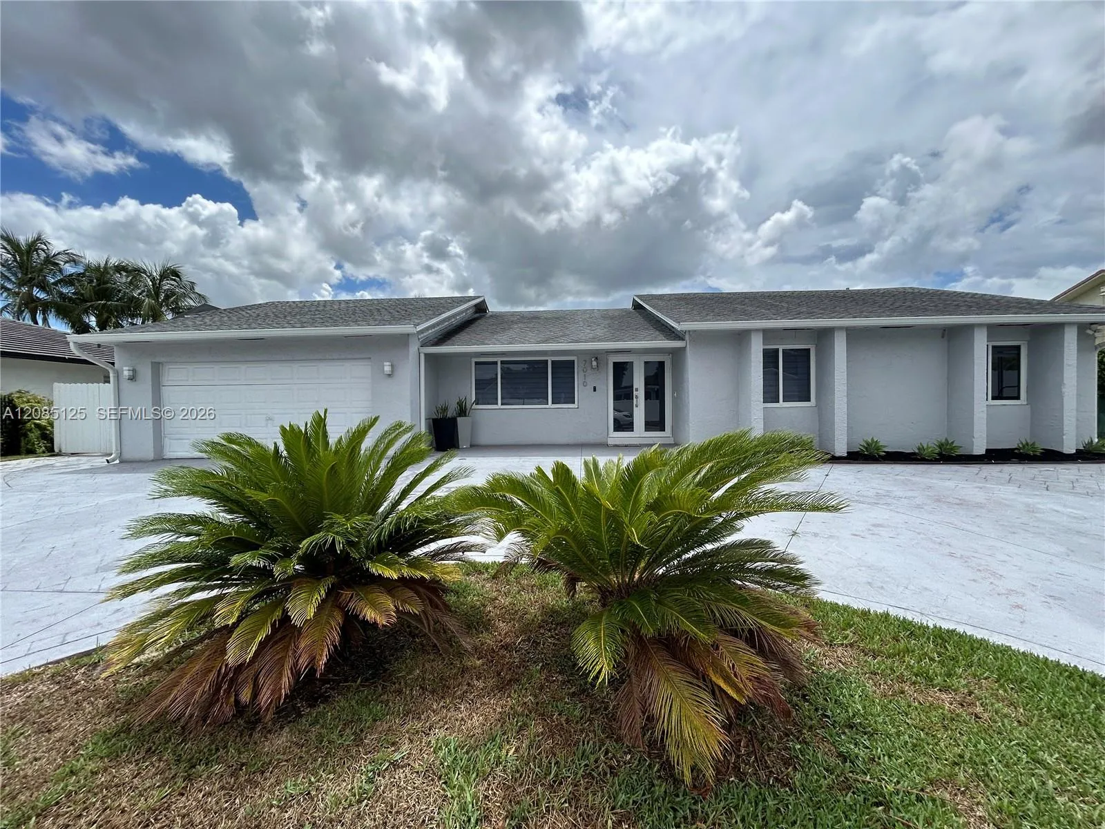 Foto de propiedad en 7010 SW 144th Place 7010, Miami, FL 33183 Miami con MLS# 