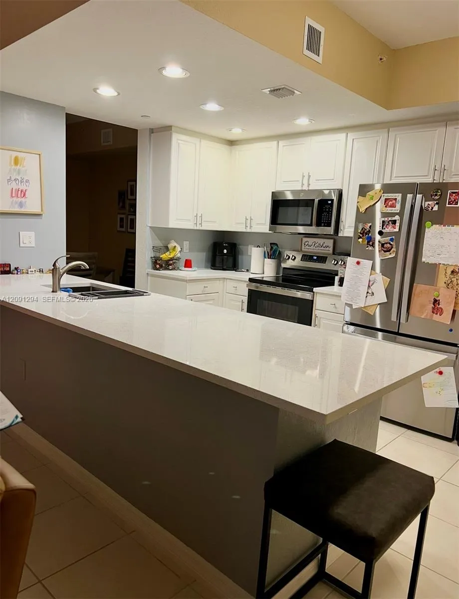 Foto de propiedad en 7735 Yardley Drive 213, Tamarac, FL 33321 Tamarac con MLS# 