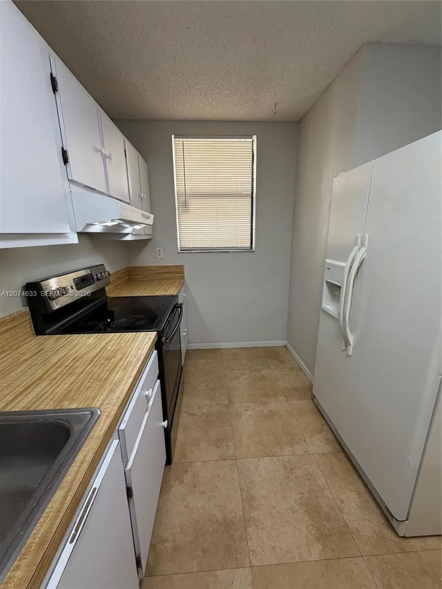 Foto de propiedad en 8429 Forest Hills Drive 202, Coral Springs, FL 33065 Coral Springs con MLS# 