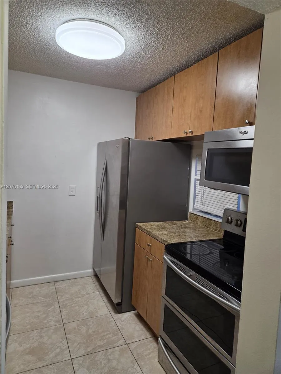 Foto de propiedad en 8550 N Sherman Circle 103, Miramar, FL 33025 Miramar con MLS# 