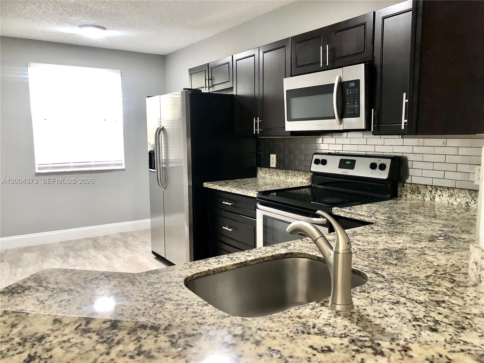 Foto de propiedad en 8761 Wiles Road 306, Coral Springs, FL 33067 Coral Springs con MLS# 