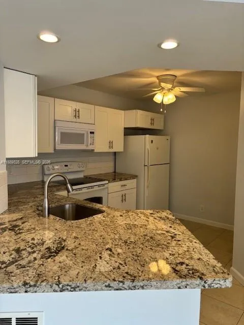 Foto de propiedad en 8977 Wiles Road 103, Coral Springs, FL 33067 Coral Springs con MLS# 