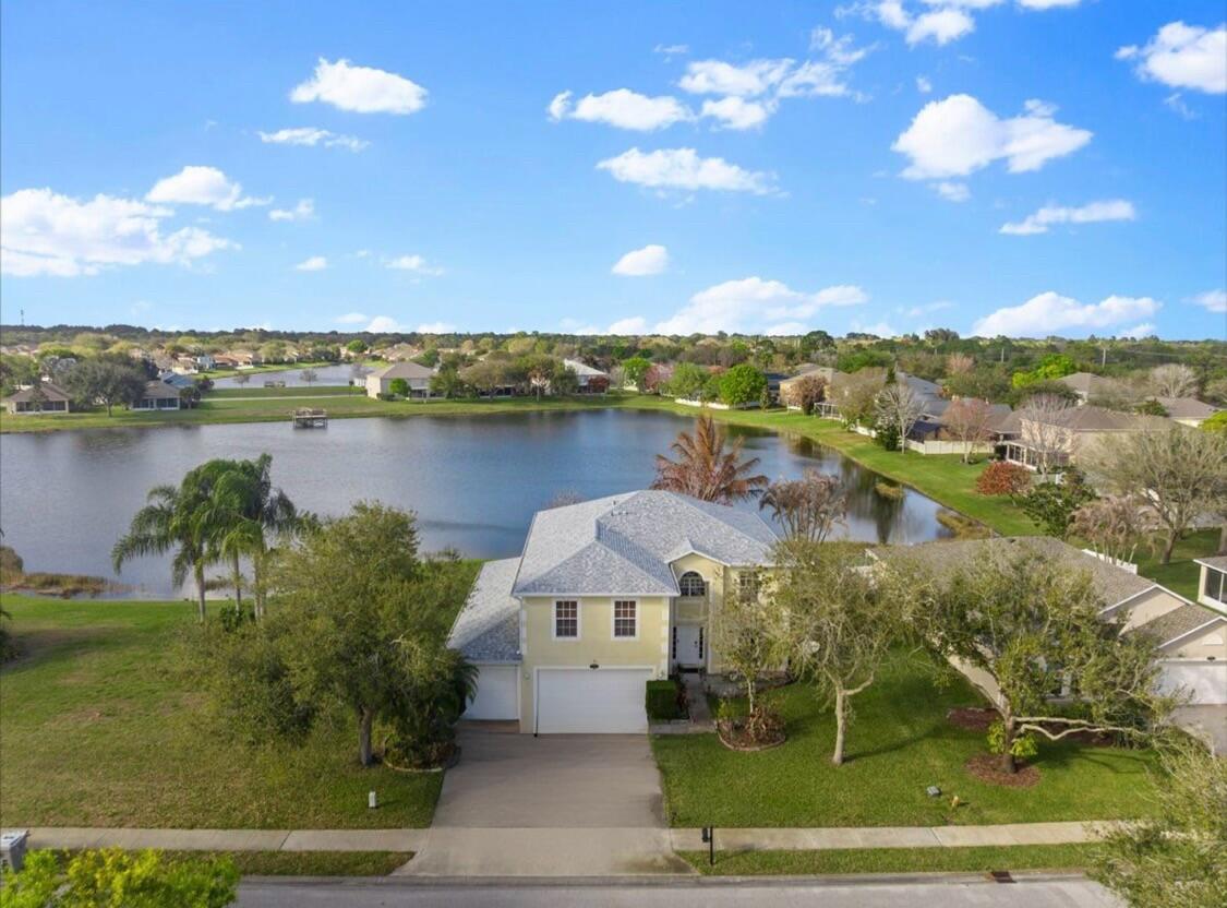 Lakefront | with lake views in every room of the house except one with 2 covered patios overlooking the lake! 4 Bedrooms + Loft + Den | 3-Car Garage | Nearly 2,900 Sq Ft | Gated Community | Low HOA a gem for this price! Call now for private tour!