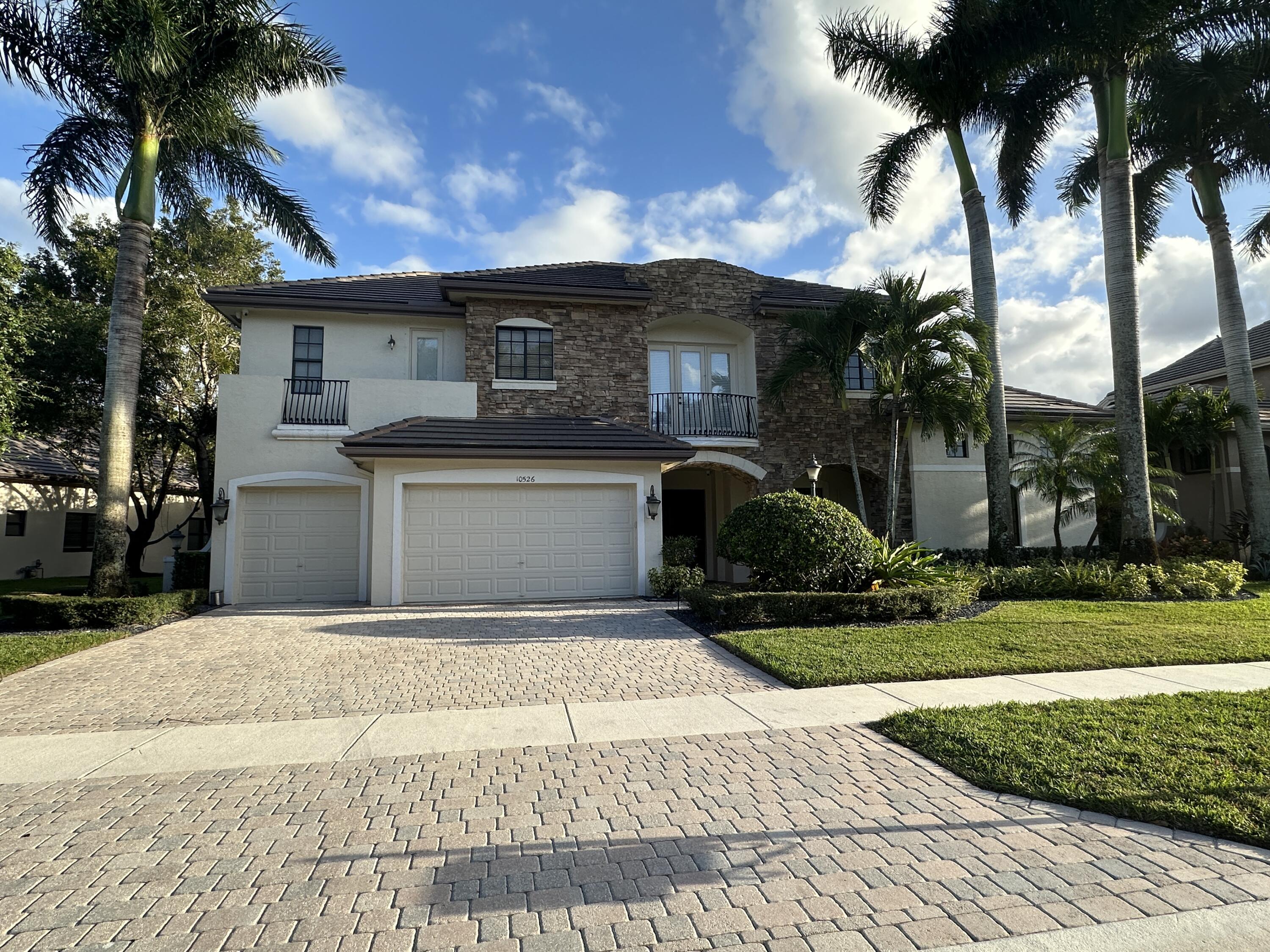 Foto de propiedad en 10526 Versailles Boulevard, Wellington, FL 33449 Wellington con MLS# 