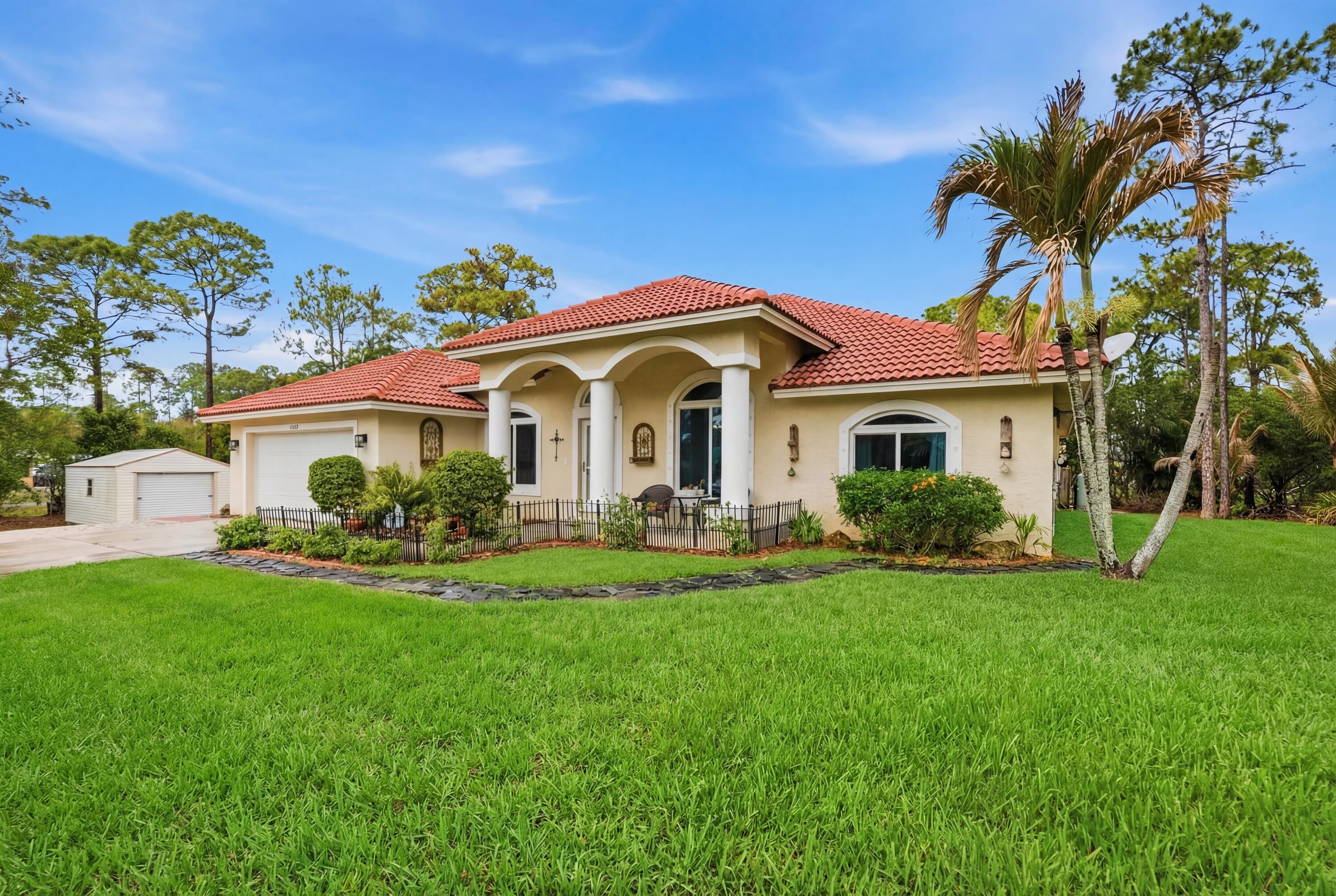 Foto de propiedad en 15327 64th Place N, The Acreage, FL 33470 The Acreage con MLS# 