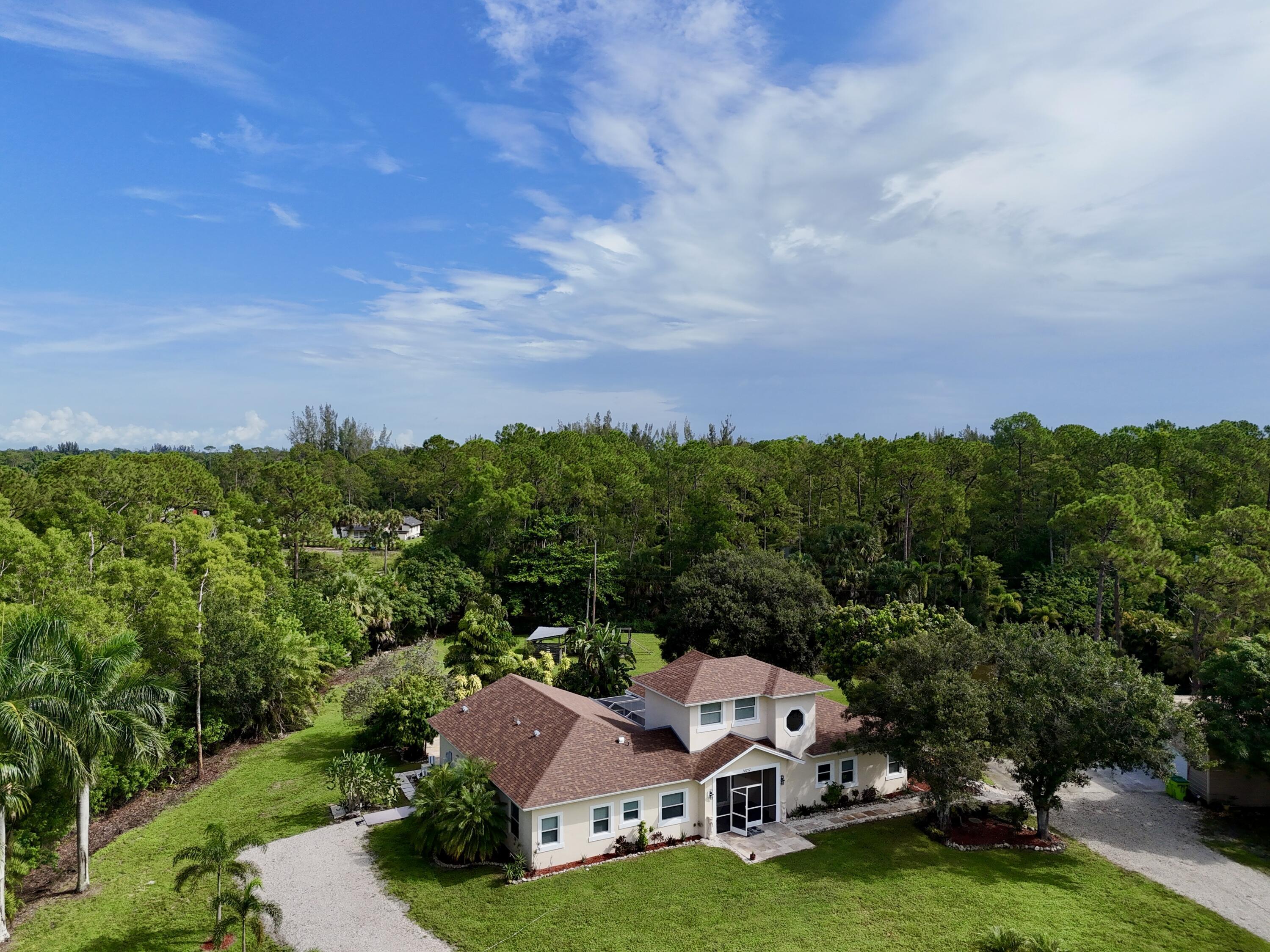 Foto de propiedad en 14717 11th Terrace, Loxahatchee Groves, FL 33470 Loxahatchee Groves con MLS# 
