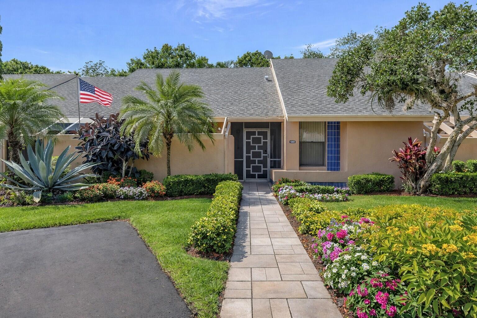 Inviting front entry with tiled walkway & welcoming curb appeal.