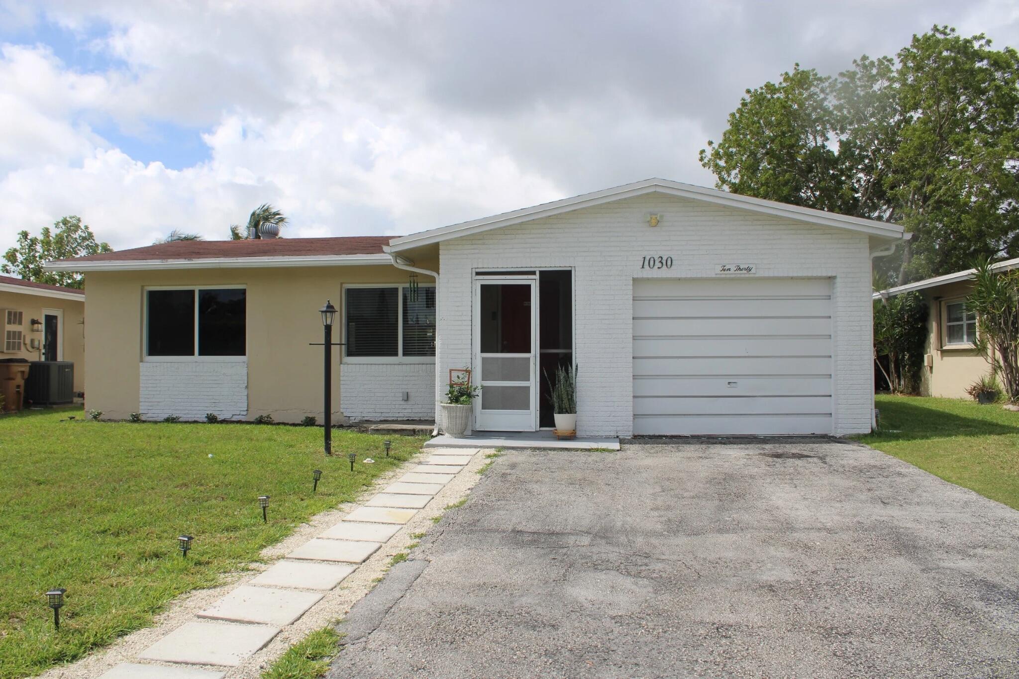 Foto de propiedad en 1030 NW 49th Court, Deerfield Beach, FL 33064 Deerfield Beach con MLS# 