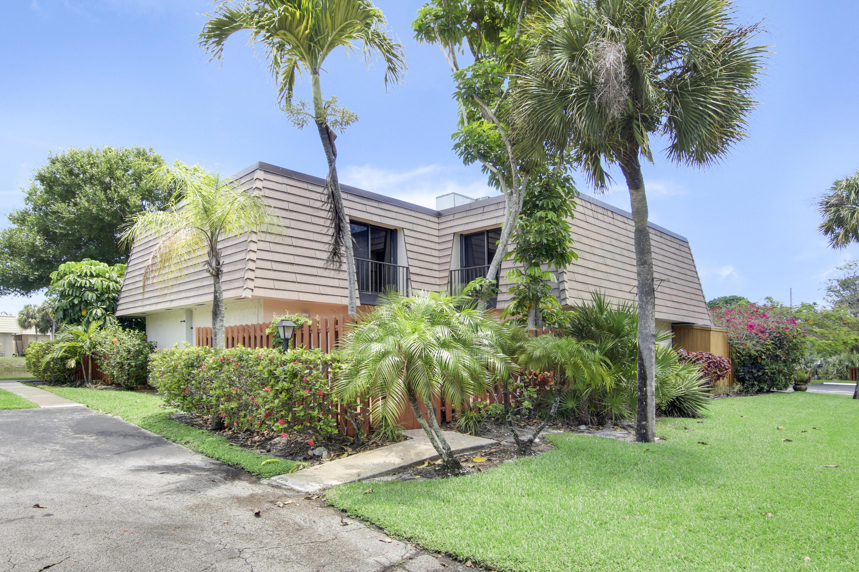 This unit wraps around a fully fenced private patio.
