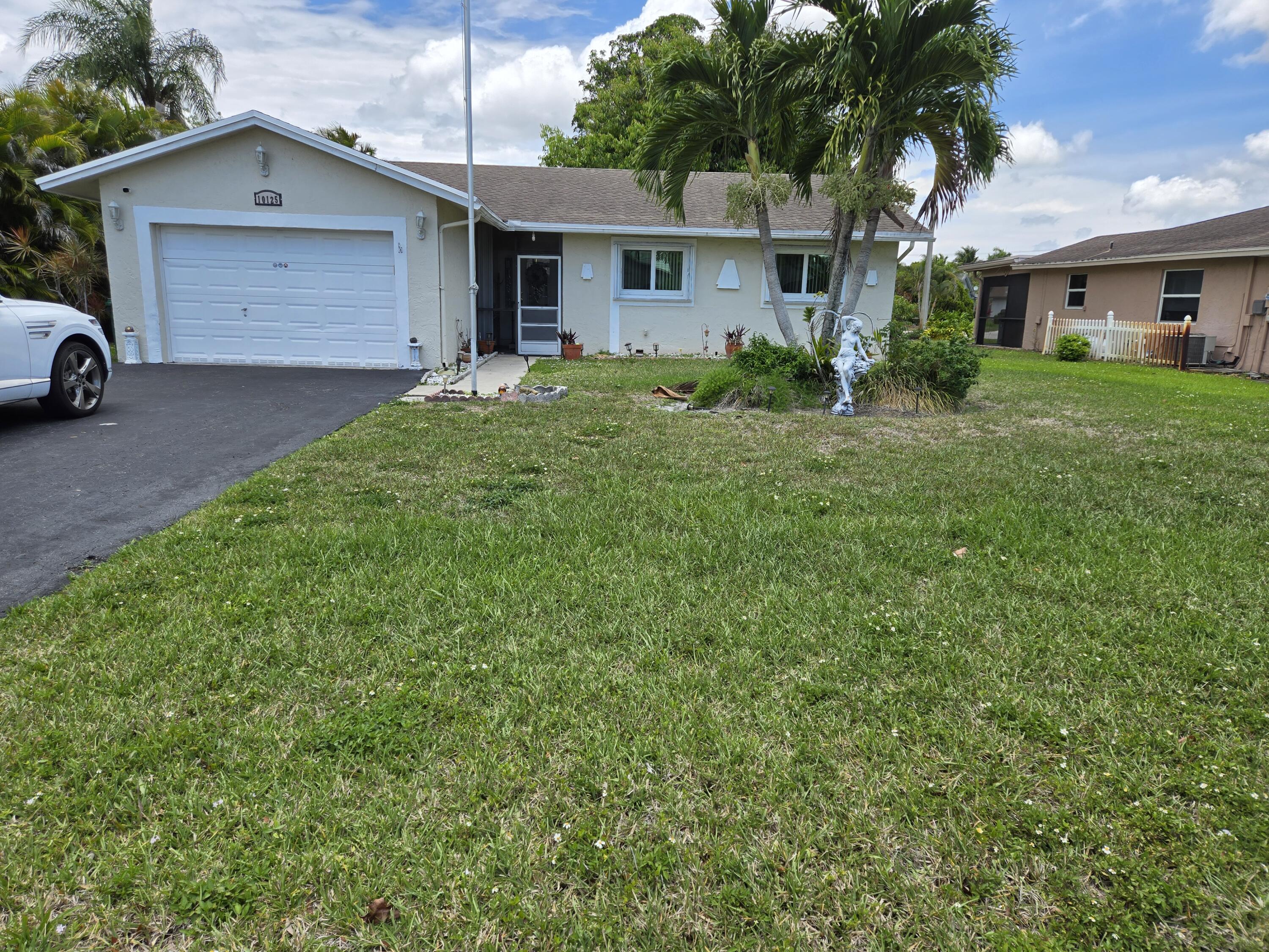 Foto de propiedad en 10125 NW 71st Street, Tamarac, FL 33321 Tamarac con MLS# 