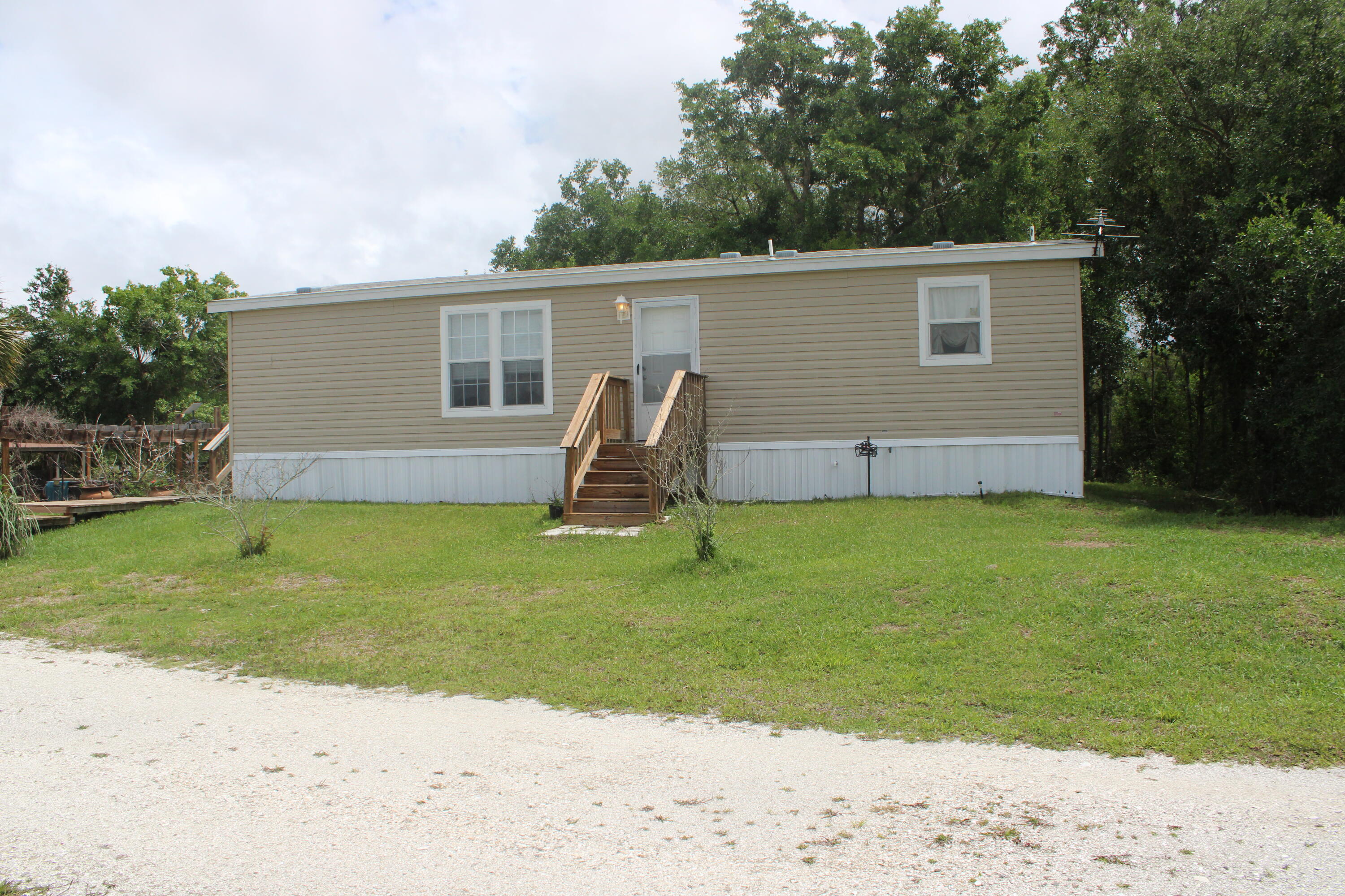 Foto de propiedad en 15367 NW 296th Street, Okeechobee, FL 34972 Okeechobee con MLS# 