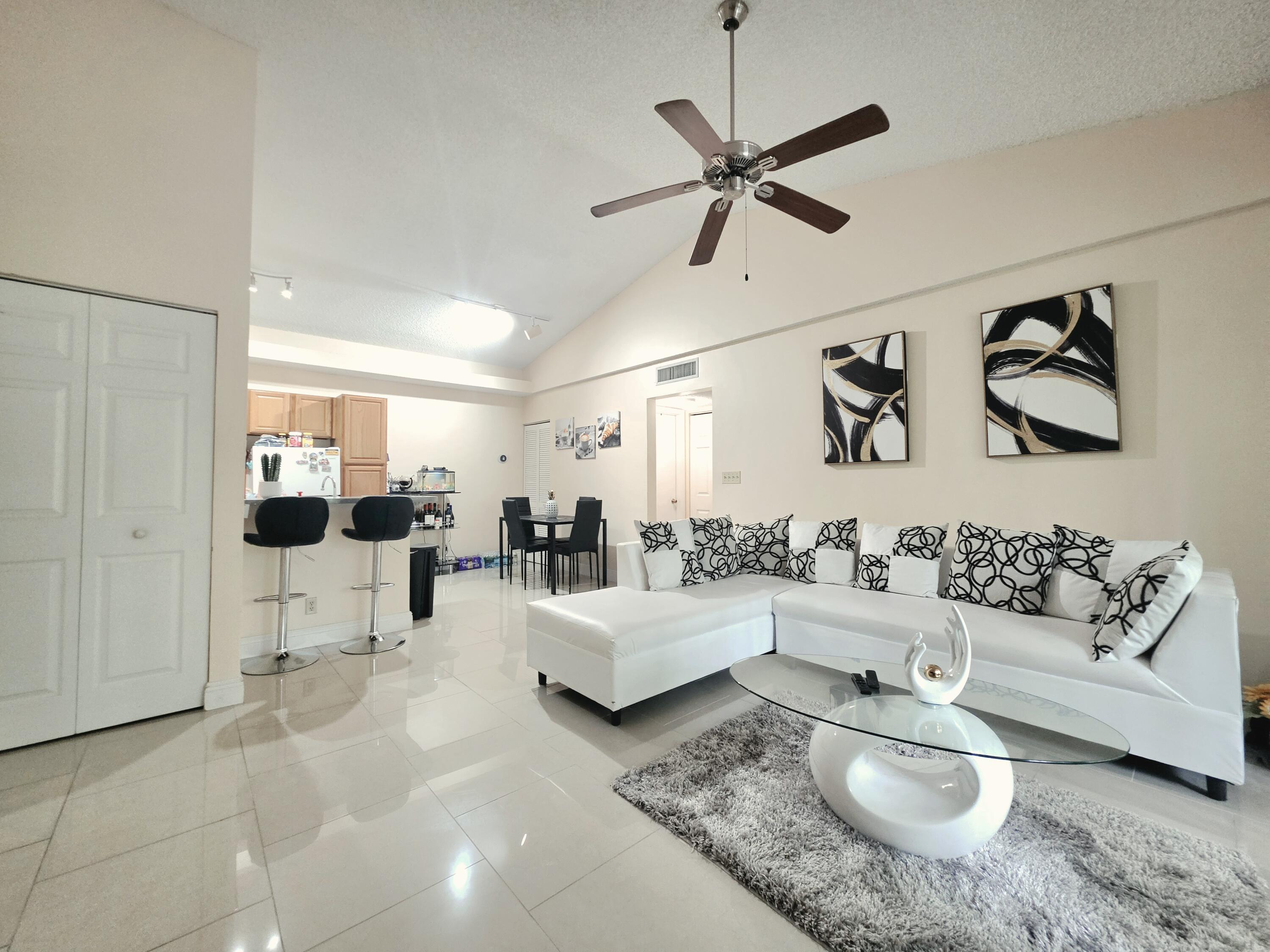 WELCOME HOME, BEAUTIFUL PORCELAIN FLOORS AND VAULTED CEILINGS
