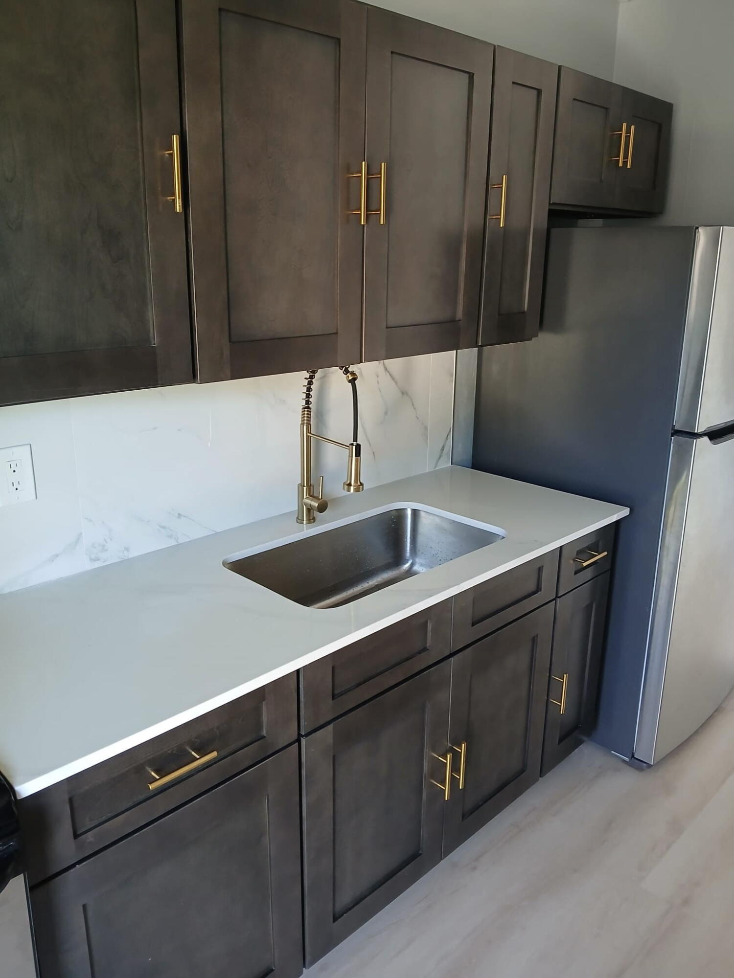 Updated kitchen with new cabinetry, counter top and fixtures.