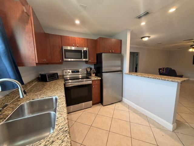 Foto de propiedad en 1983 Juno Road, North Palm Beach, FL 33408 North Palm Beach con MLS# 