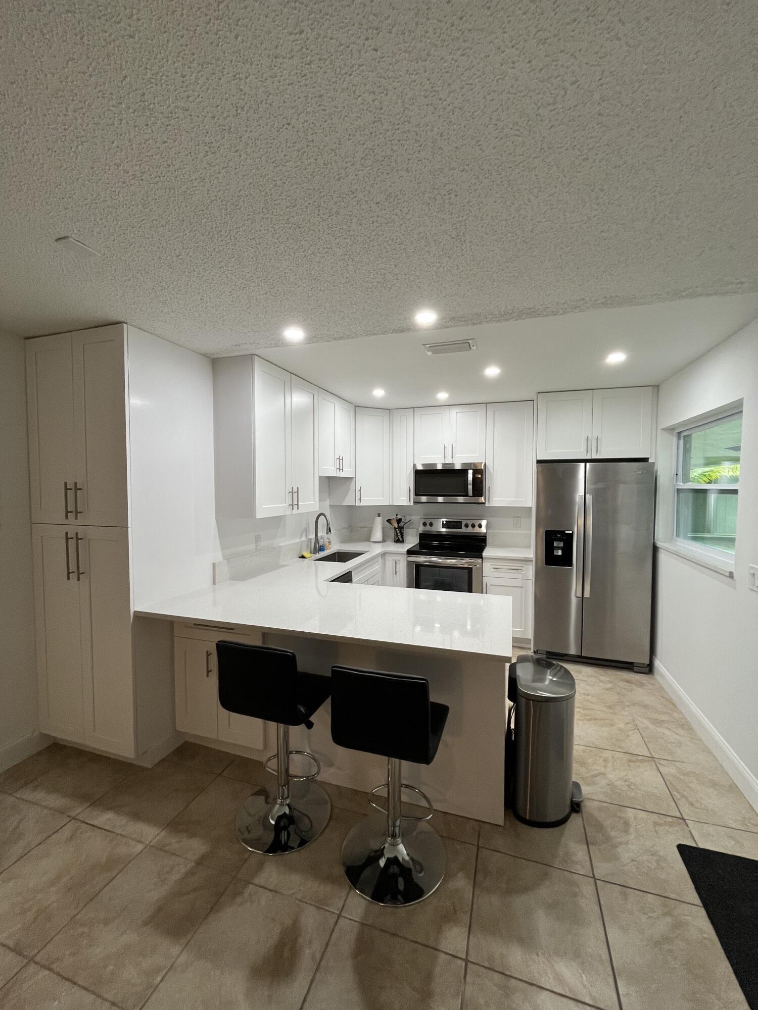 Foto de propiedad en 1979 Juno Road, North Palm Beach, FL 33408 North Palm Beach con MLS# 
