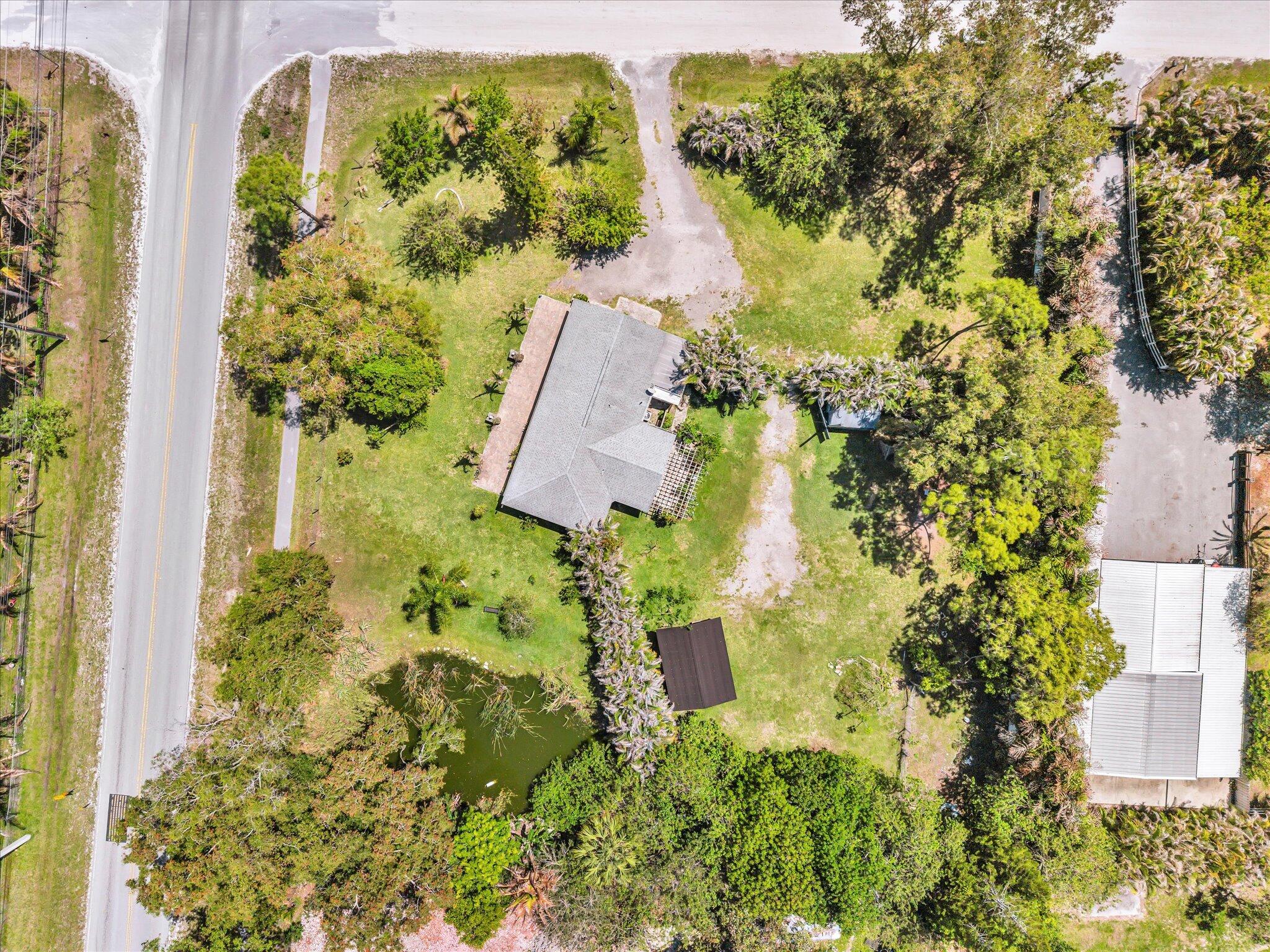 Foto de propiedad en 5209 Coconut Boulevard, The Acreage, FL 33411 The Acreage con MLS# 