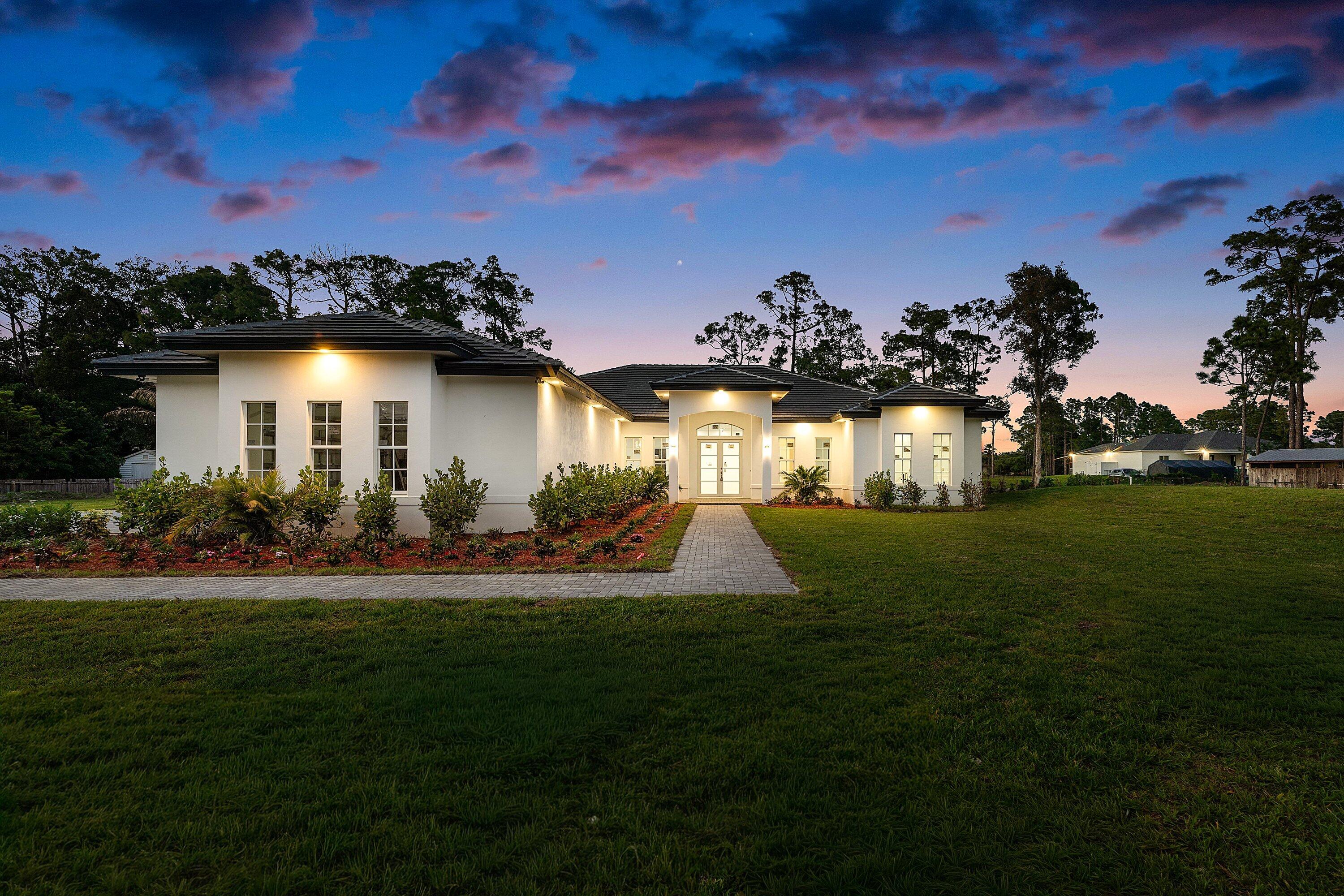 Foto de propiedad en 15090 Temple Boulevard, The Acreage, FL 33470 The Acreage con MLS# 