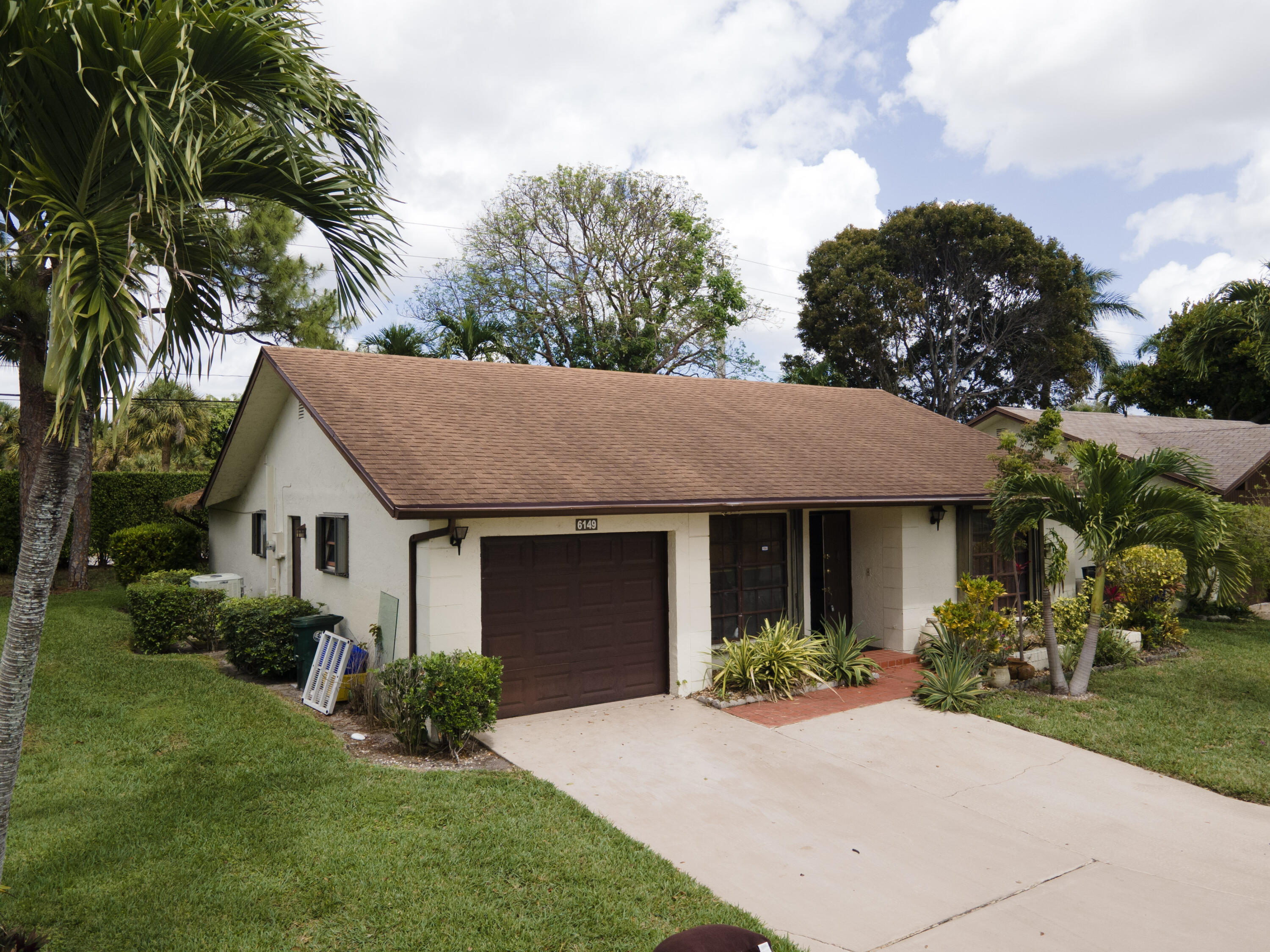 Foto de propiedad en 6149 Olivewood Circle, Greenacres, FL 33463 Greenacres con MLS# 