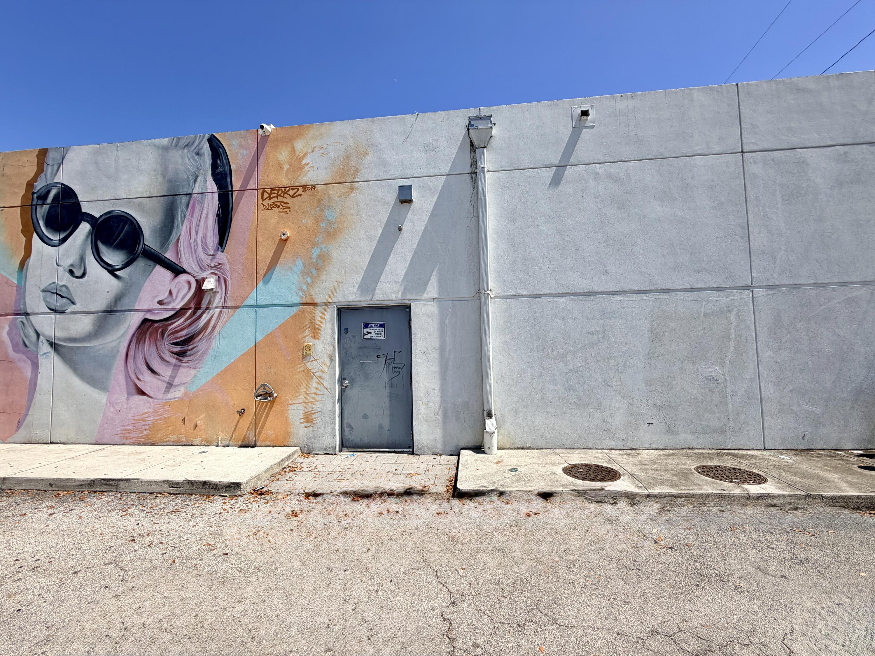 The space is located on the back side of a retail building with a restaurant and club.