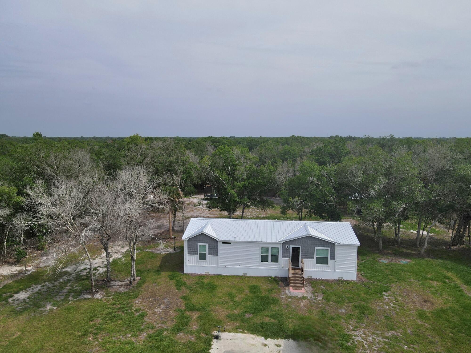 Foto de propiedad en 19411 NW 258th Street, Okeechobee, FL 34972 Okeechobee con MLS# 