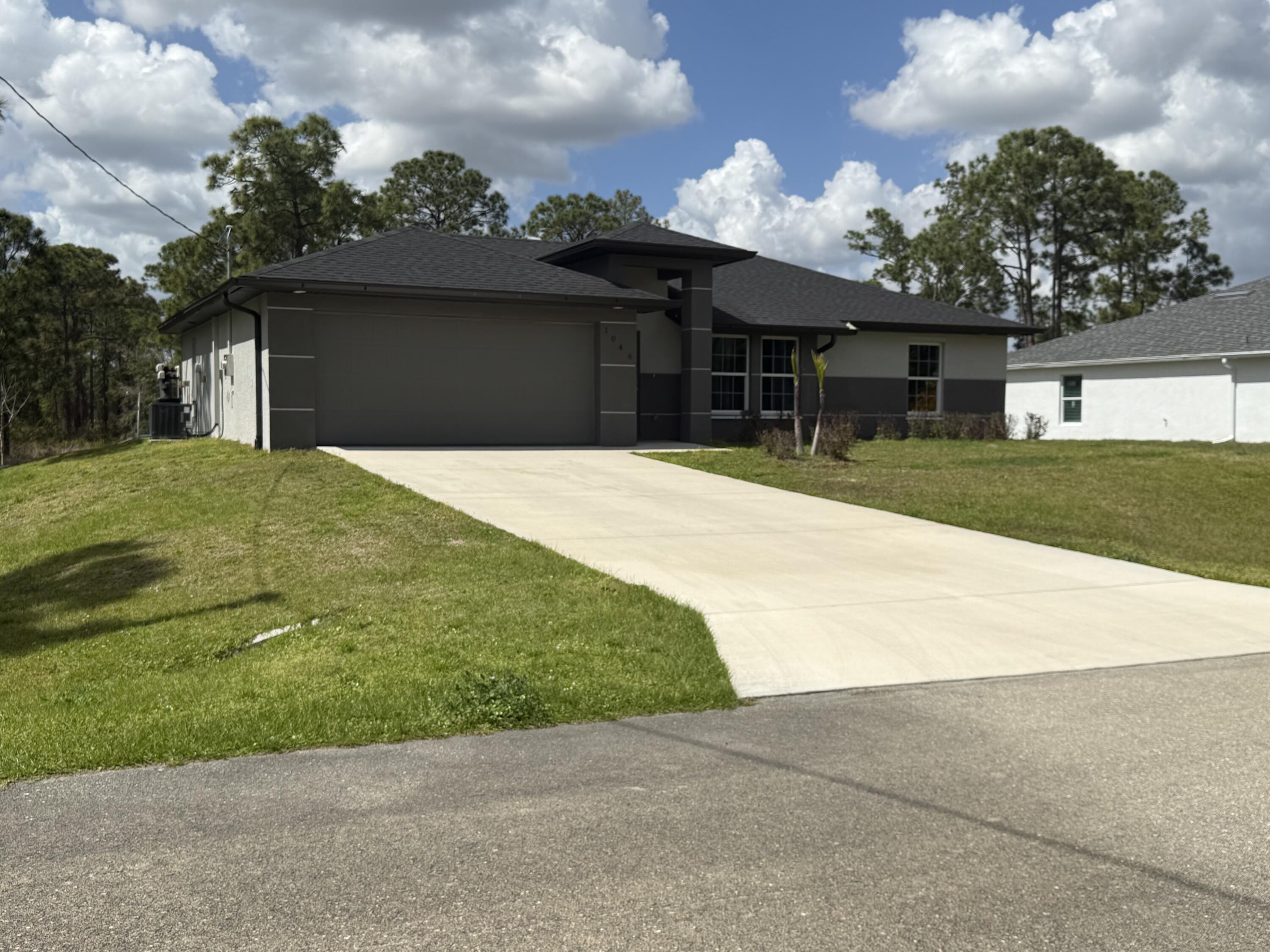 Foto de propiedad en 1046 S Cheney Ave Avenue S, Lehigh Acres, FL 33974 Lehigh Acres con MLS# 