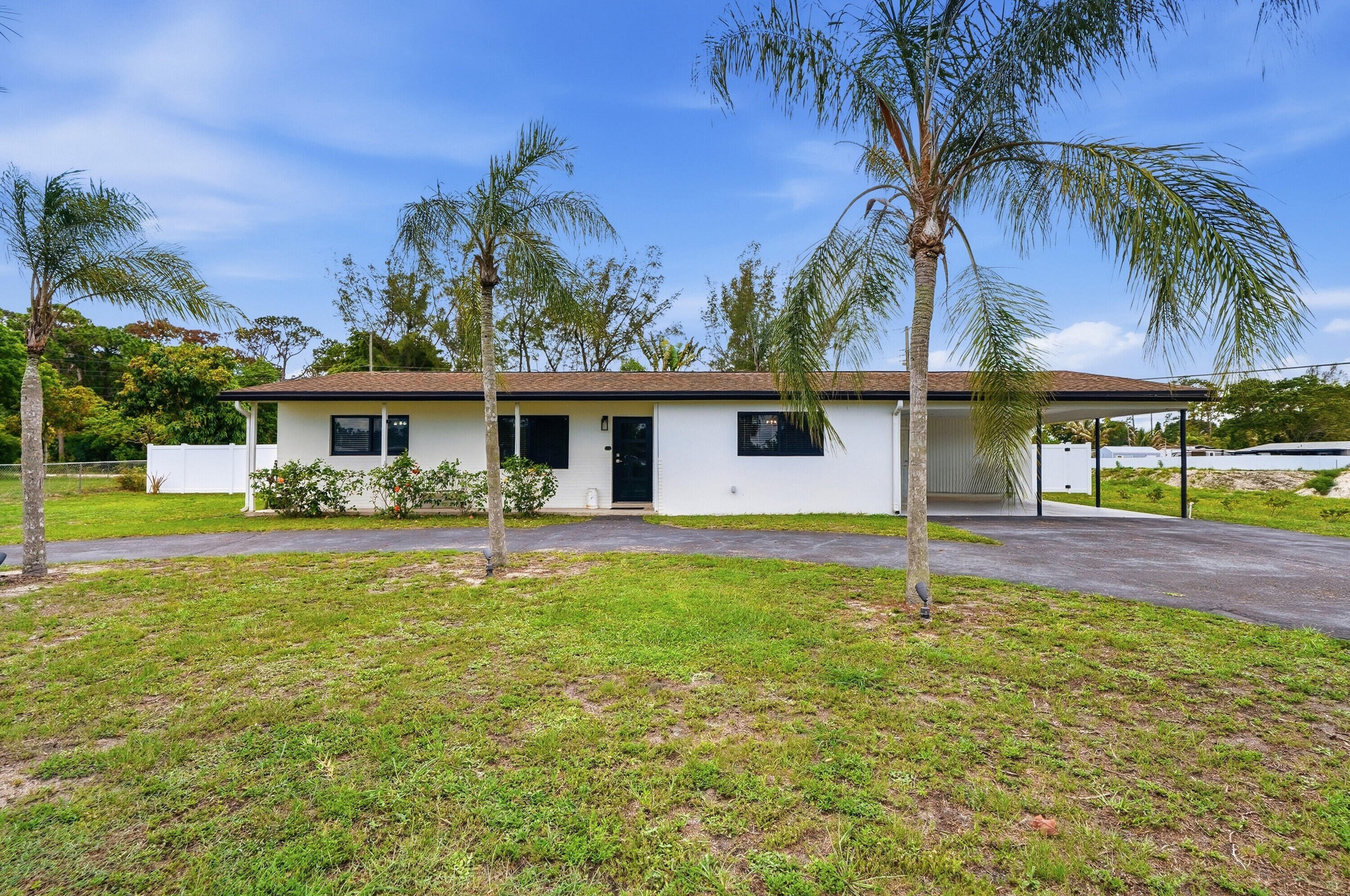 Large front yard and circular driveway