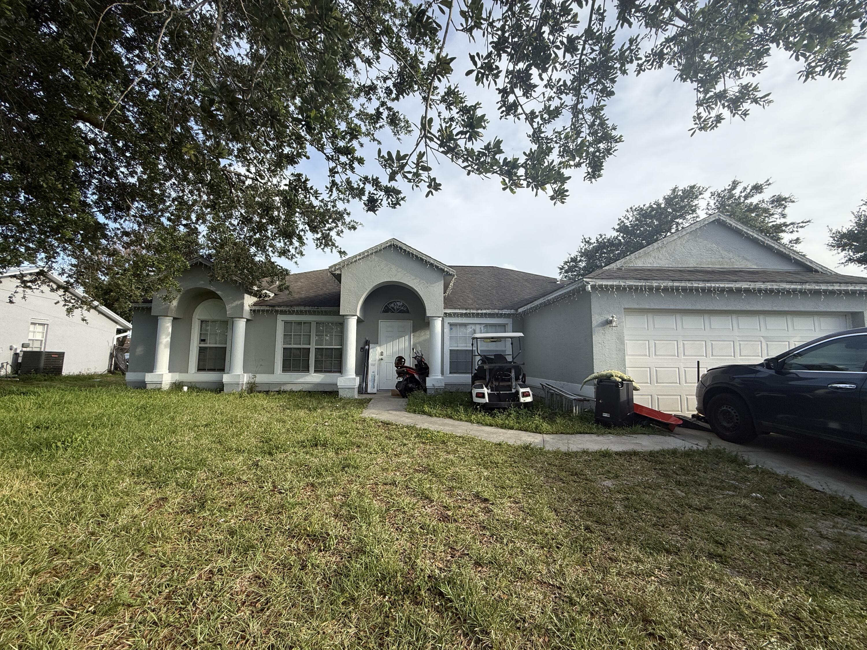 Foto de propiedad en 742 NW Bayard Avenue, Port St. Lucie, FL 34983 Port St. Lucie con MLS# 