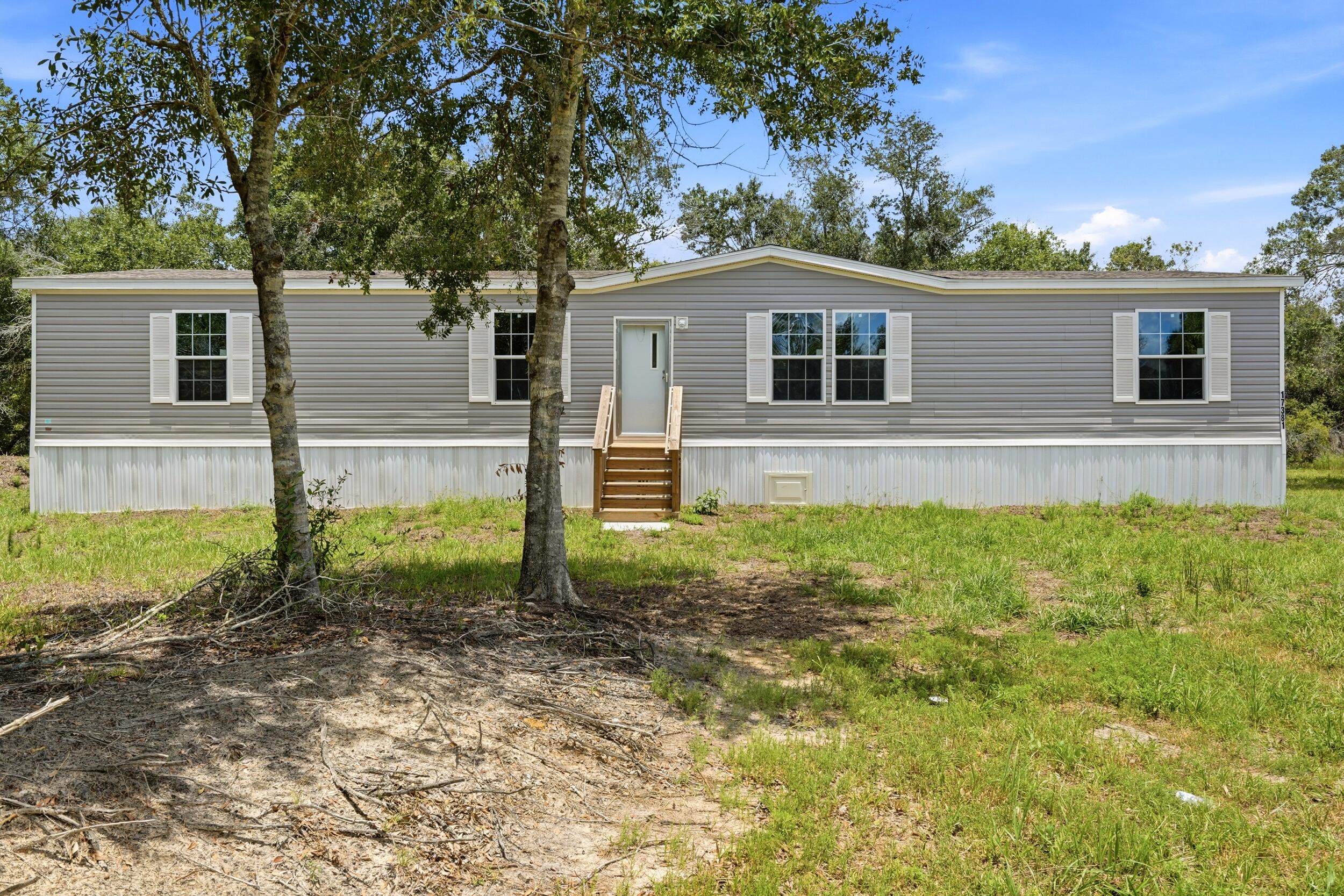 Foto de propiedad en 17381 NW 262nd Street, Okeechobee, FL 34972 Okeechobee con MLS# 